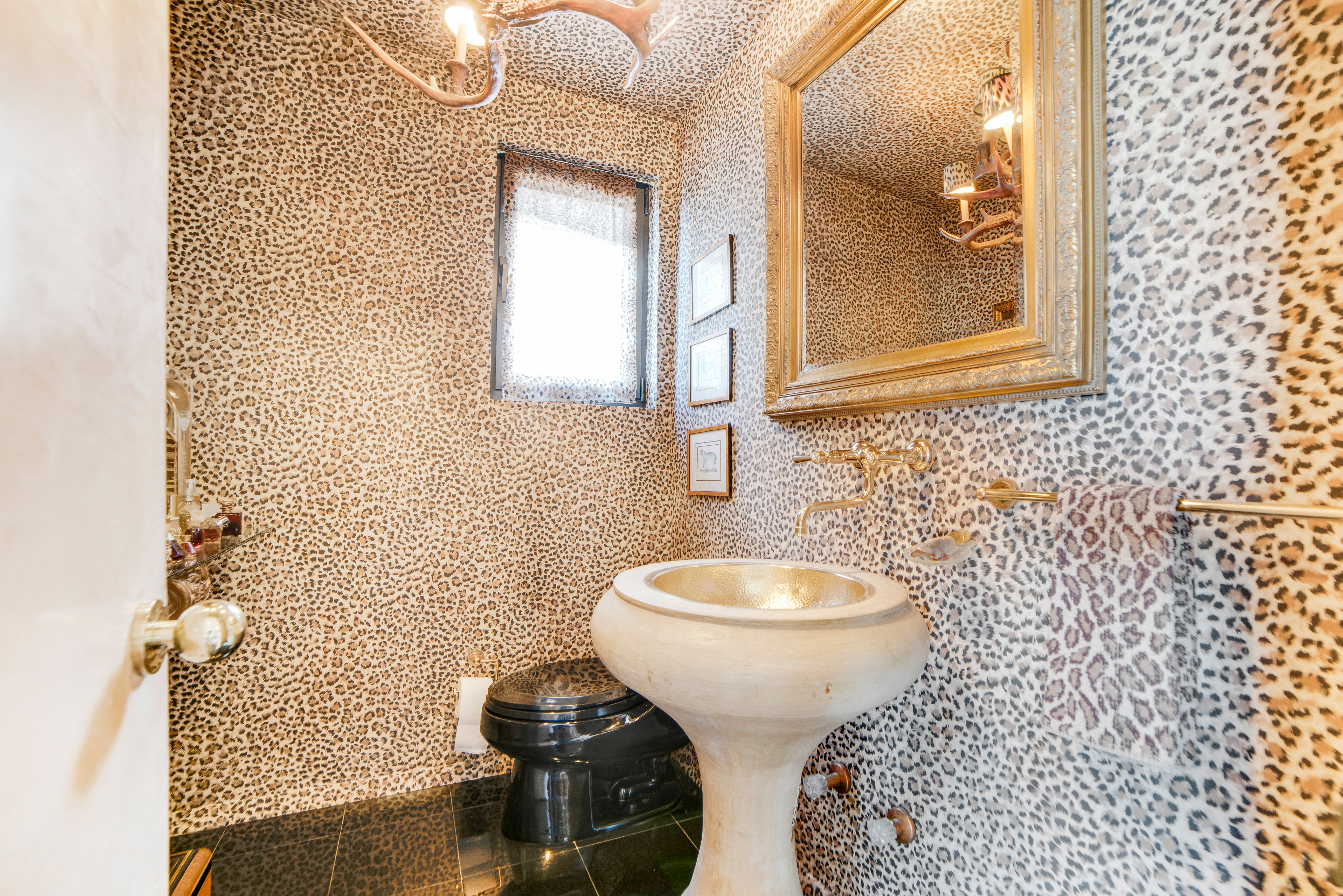 200 Central Park South, Unit 24A Manhattan, NY 10019 - Photo 15 of 23 a bathroom with a toilet sink and mirror
