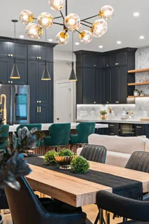 a room with furniture and view kitchen