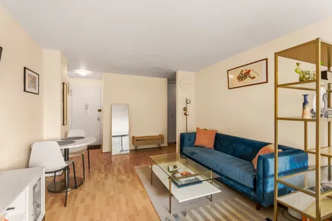 a living room with furniture and a table