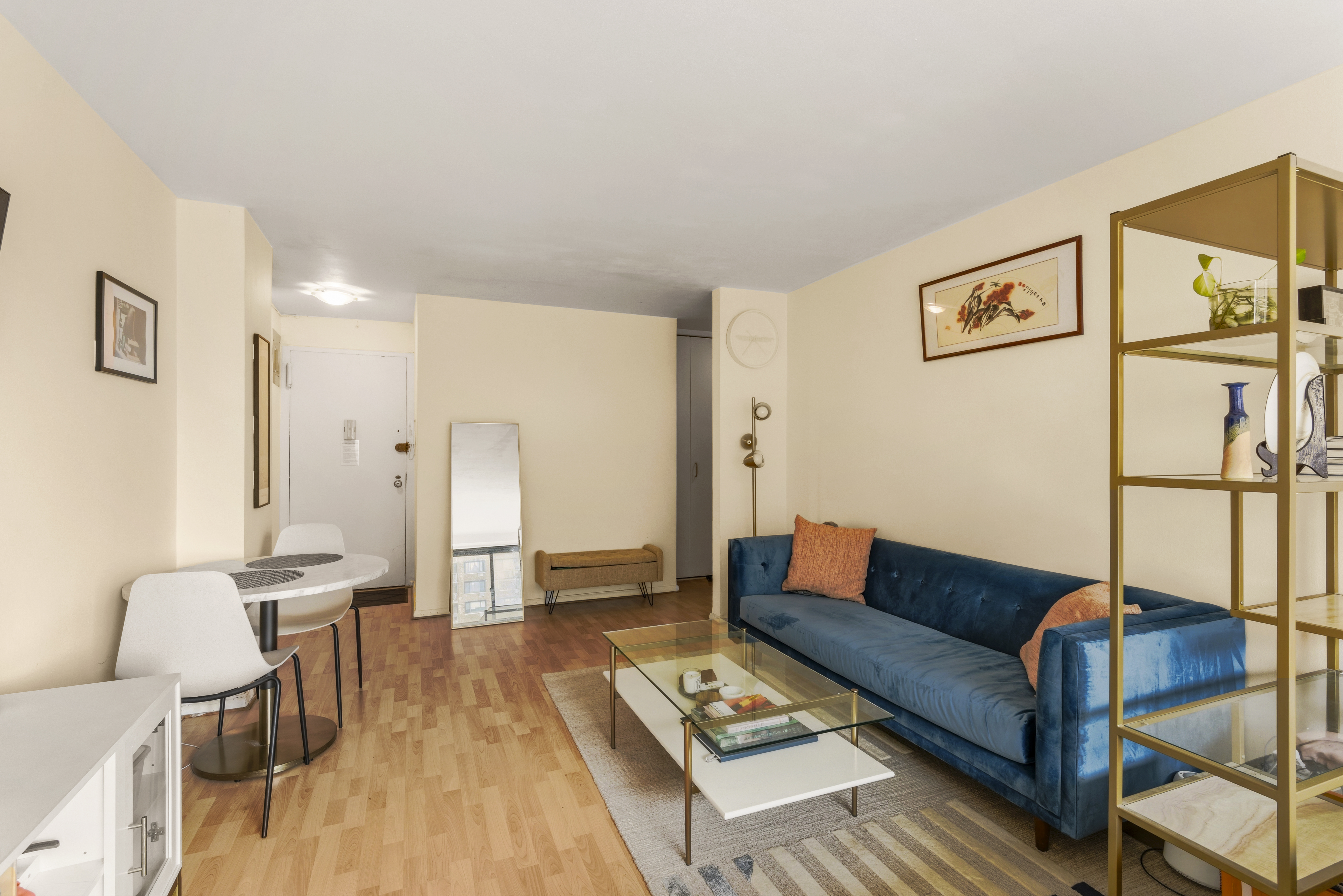 195 Willoughby Avenue, Unit 702 Brooklyn, NY 11205 - Photo 6 of 11 a living room with furniture and a table