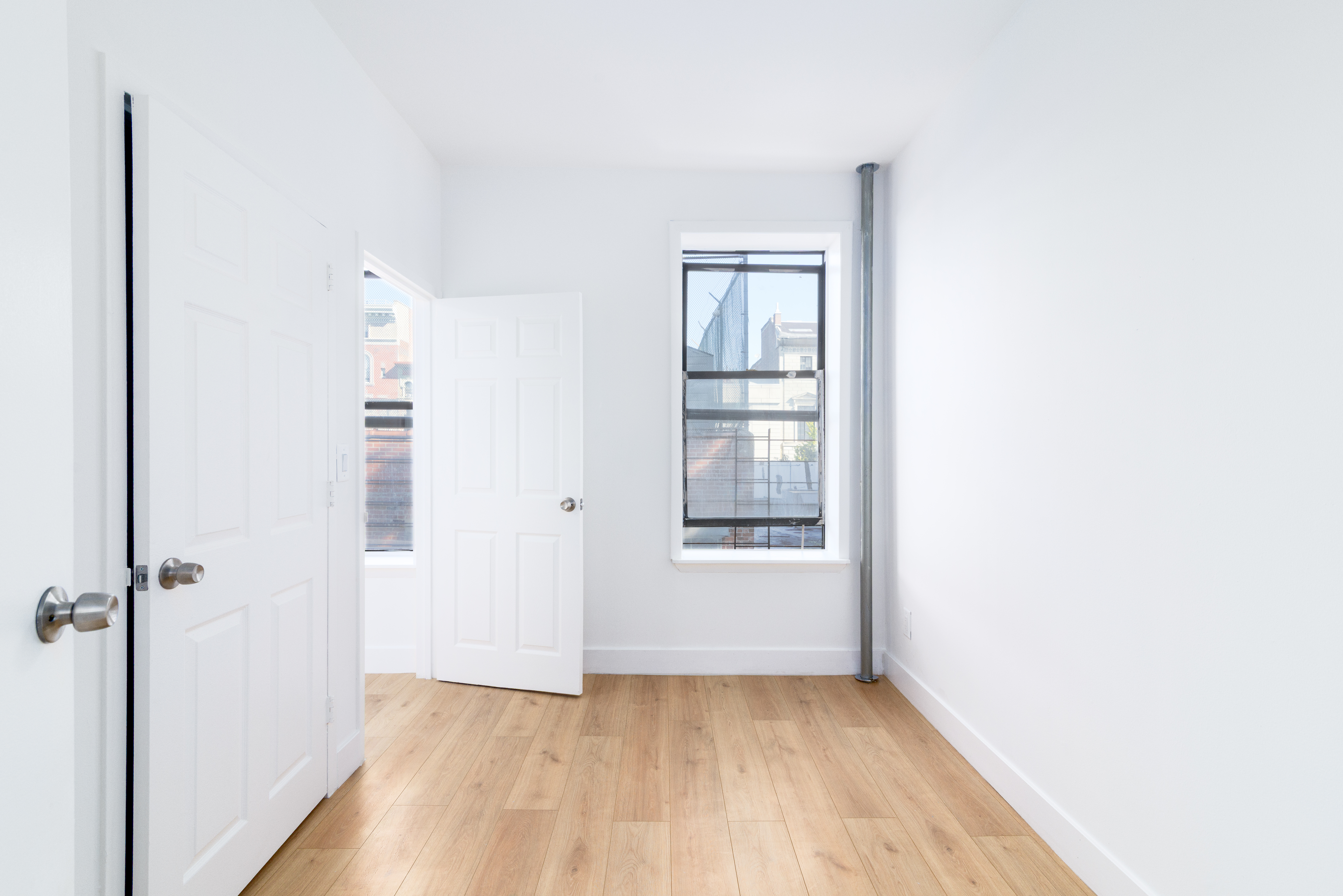 517 West 144th Street, Unit 9 Manhattan, NY 10031 - Photo 10 of 22 an empty room with windows