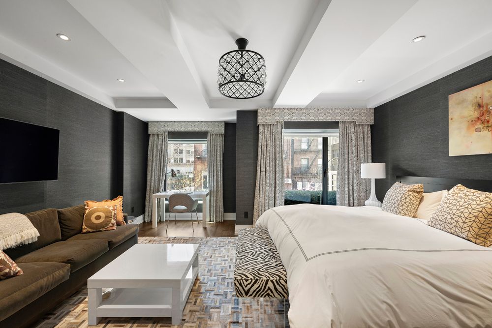 a living room with furniture fireplace and flat screen tv