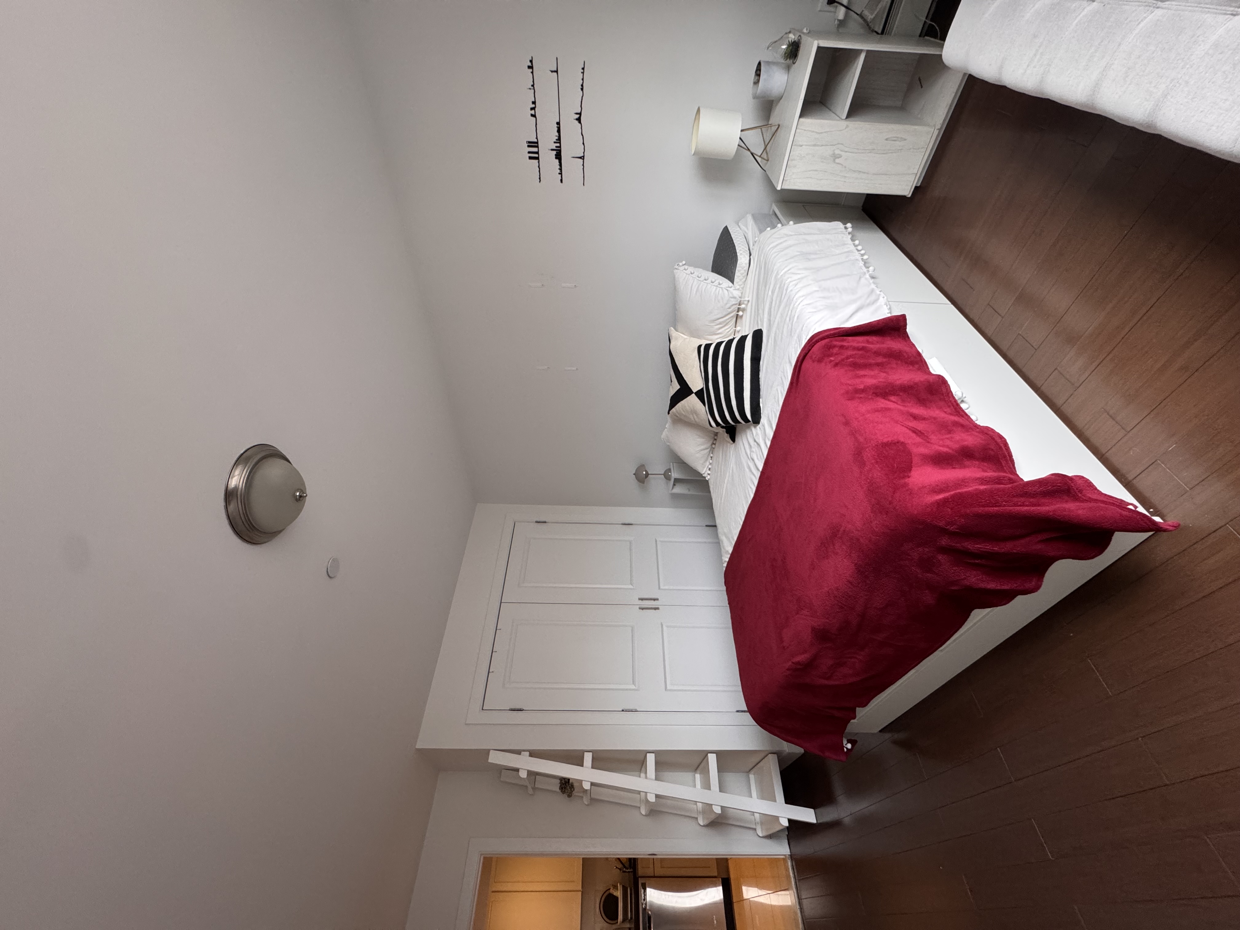 201 Huron Street, Unit 4F Brooklyn, NY 11222 - Photo 7 of 12 a bedroom with a bed and a chandelier