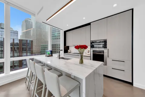 a kitchen with a table and chairs