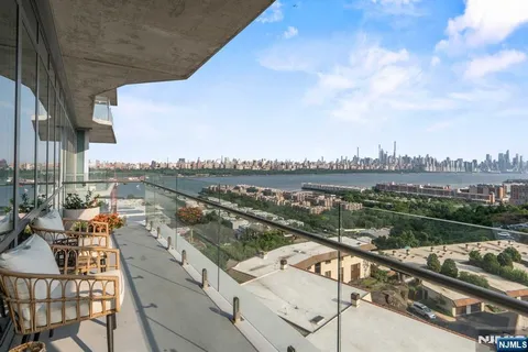 a view of a city skyline from a balcony