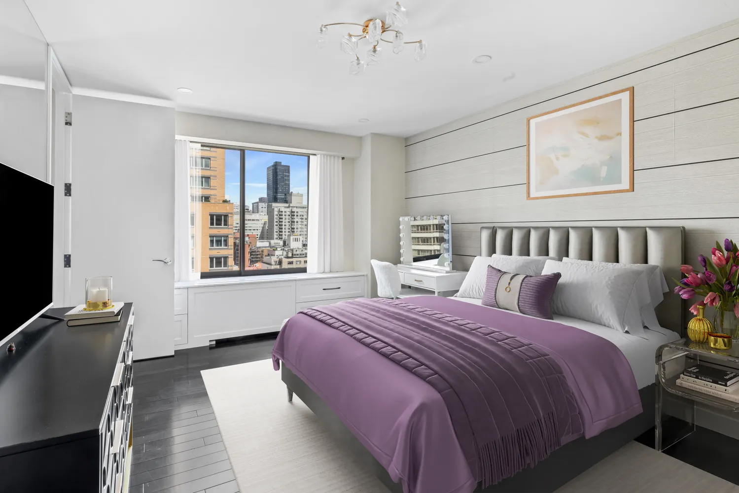 a bed room with a bed window and a television