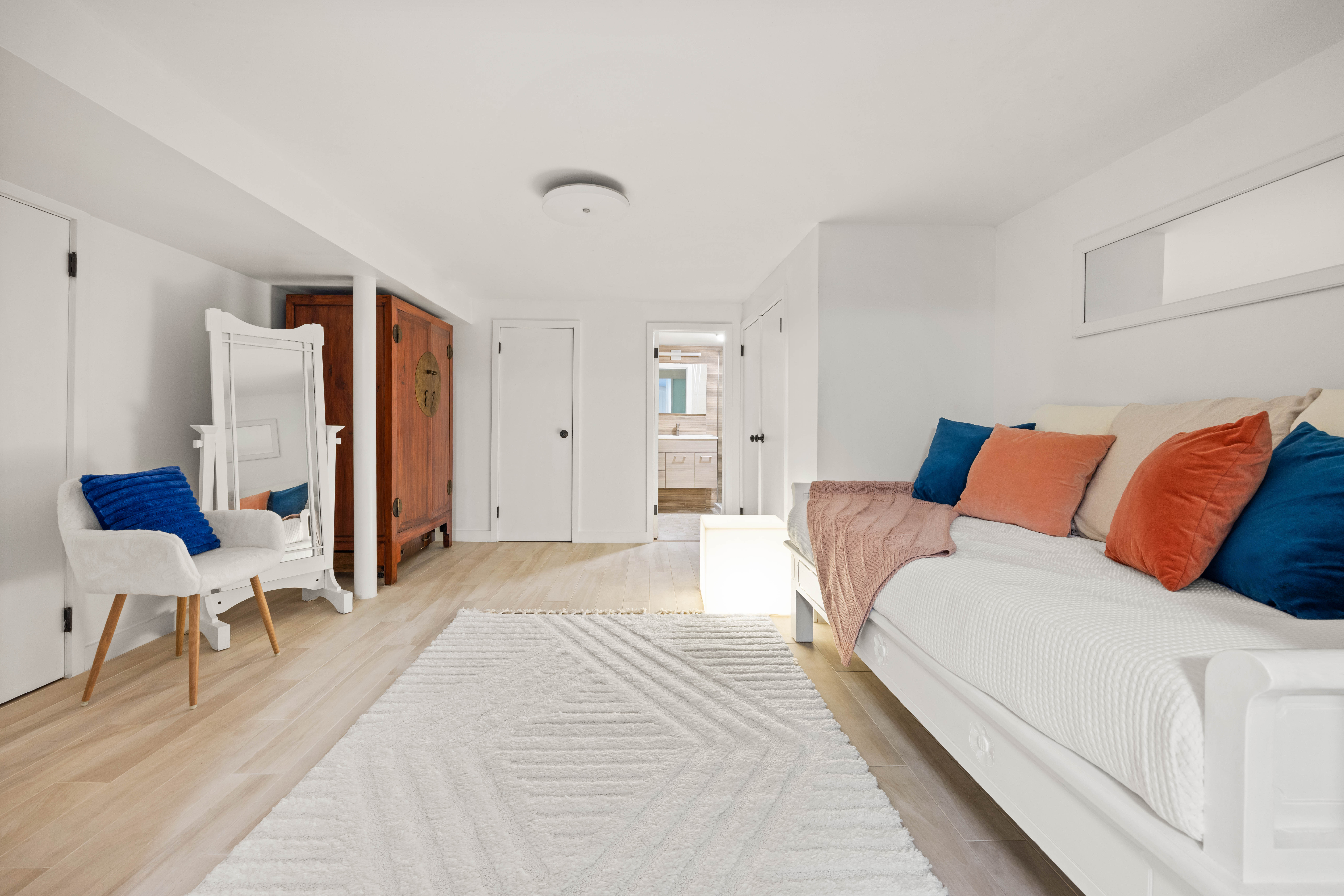 38 7th Avenue, Unit 1 Brooklyn, NY 11217 - Photo 9 of 13 a bedroom with a bed and chair