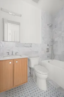 a bathroom with a sink a toilet and a bathtub