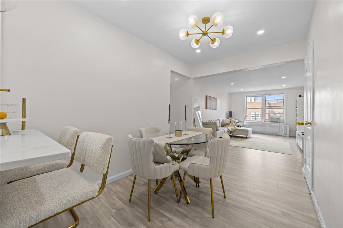 759 East 10th Street, Unit 7H Brooklyn, NY 11230 - Photo 3 of 15 a view of a dining room with furniture and wooden floor