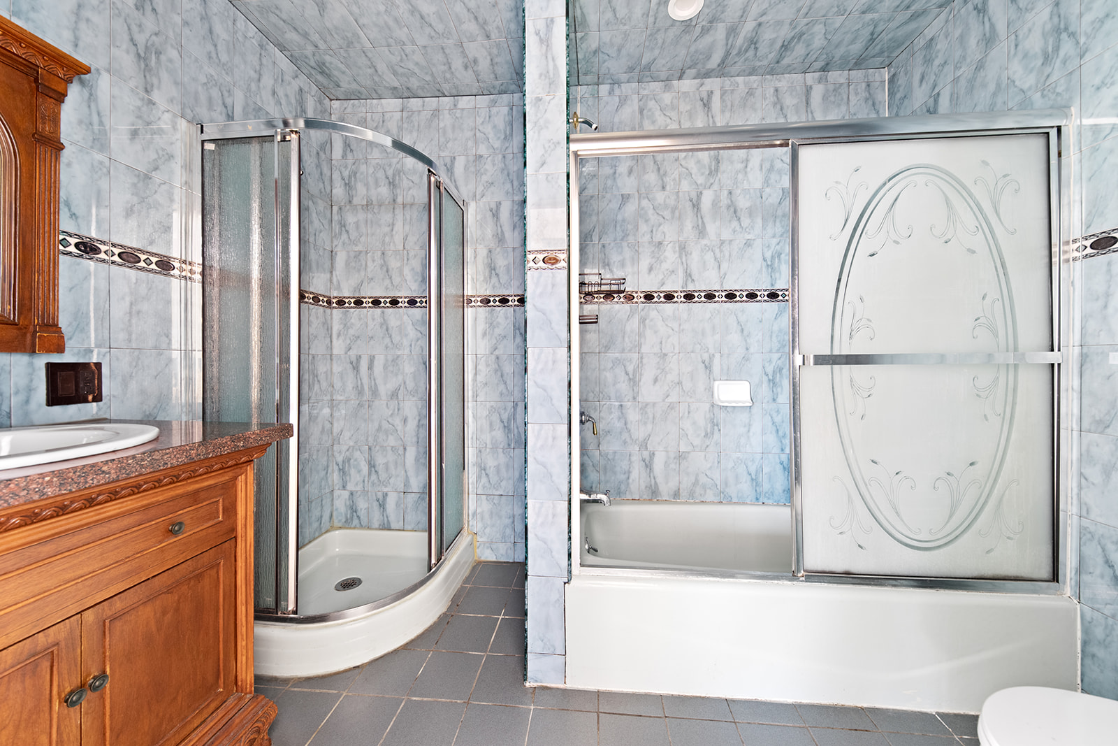 344 7th Avenue, Unit 1 Brooklyn, NY 11215 - Photo 8 of 9 a bathroom with a granite countertop sink a toilet and shower