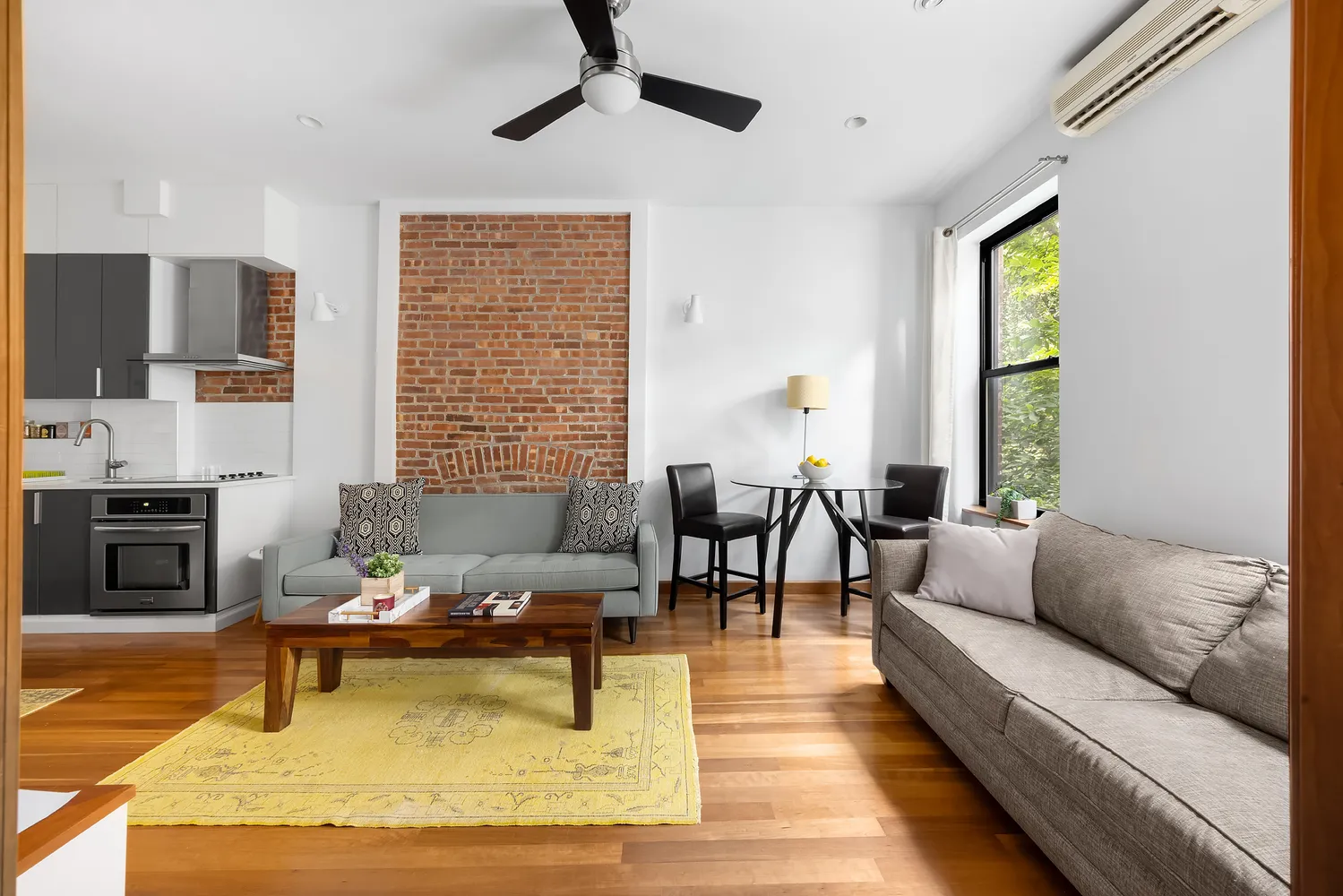 a living room with furniture windows and a fireplace
