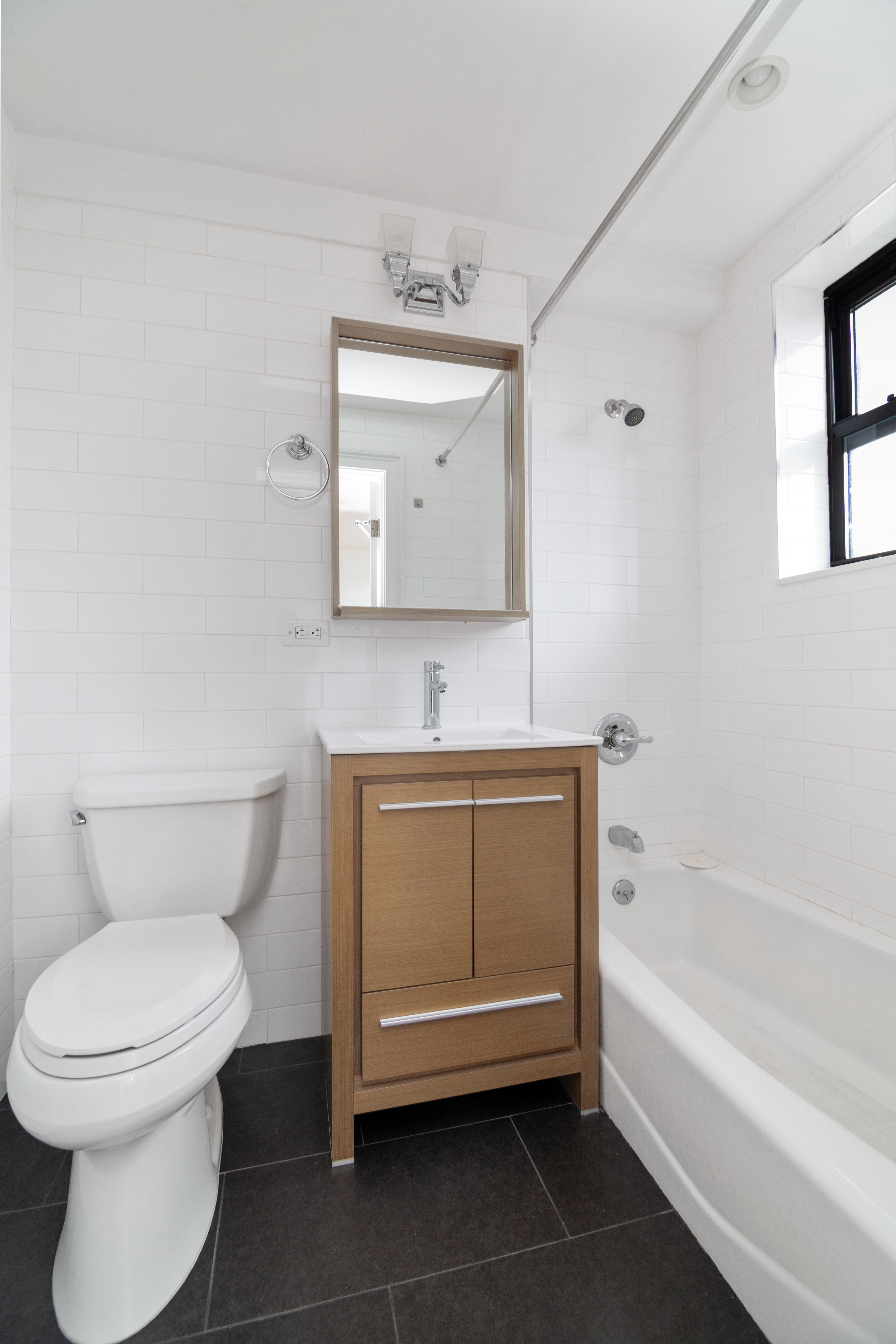69 Bennett Avenue, Unit 608 Manhattan, NY 10033 - Photo 6 of 6 a bathroom with a toilet a sink and bathtub