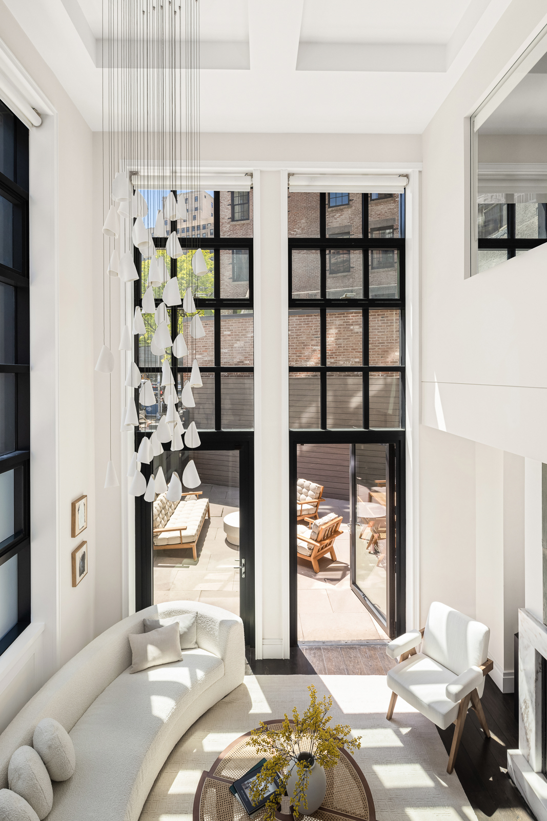 137 Franklin Street, Unit 1 Manhattan, NY 10013 - Photo 4 of 25 a bedroom with furniture and a potted plant