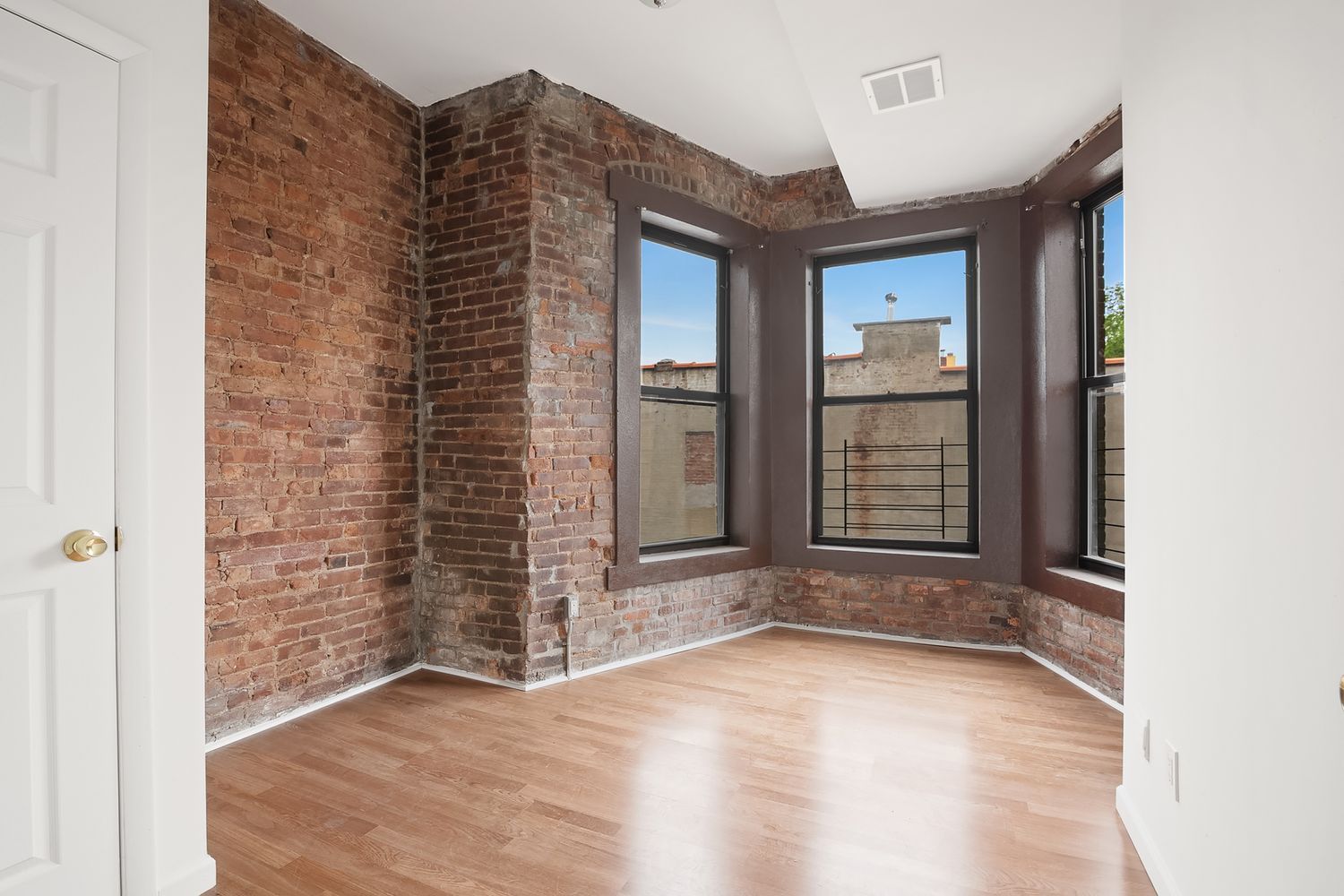1978 Madison Avenue, Unit 5 Manhattan, NY 10035 - Photo 2 of 10 an empty room with windows