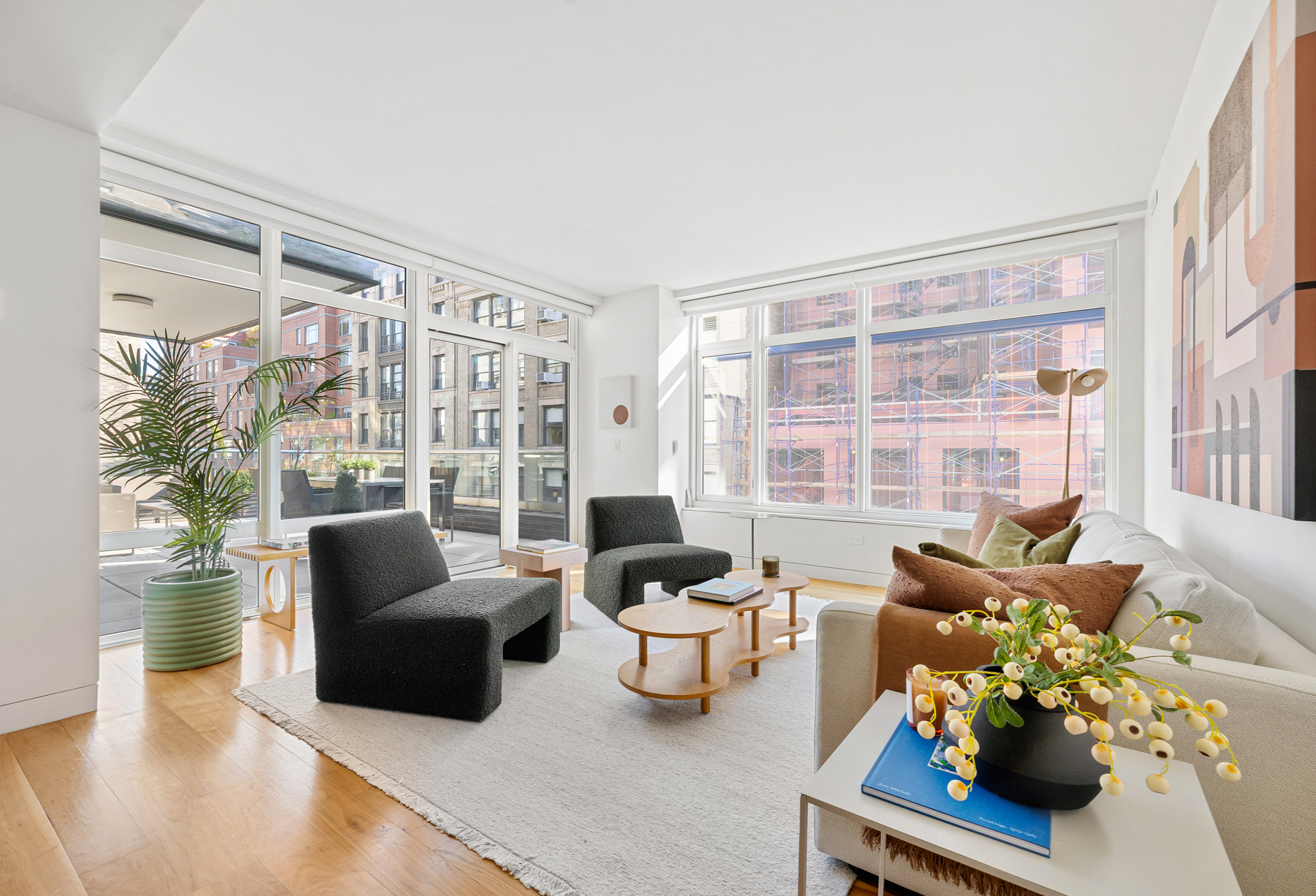 151 West 21st Street, Unit 10A Manhattan, NY 10011 - Photo 5 of 26 a living room with furniture fireplace and a large window