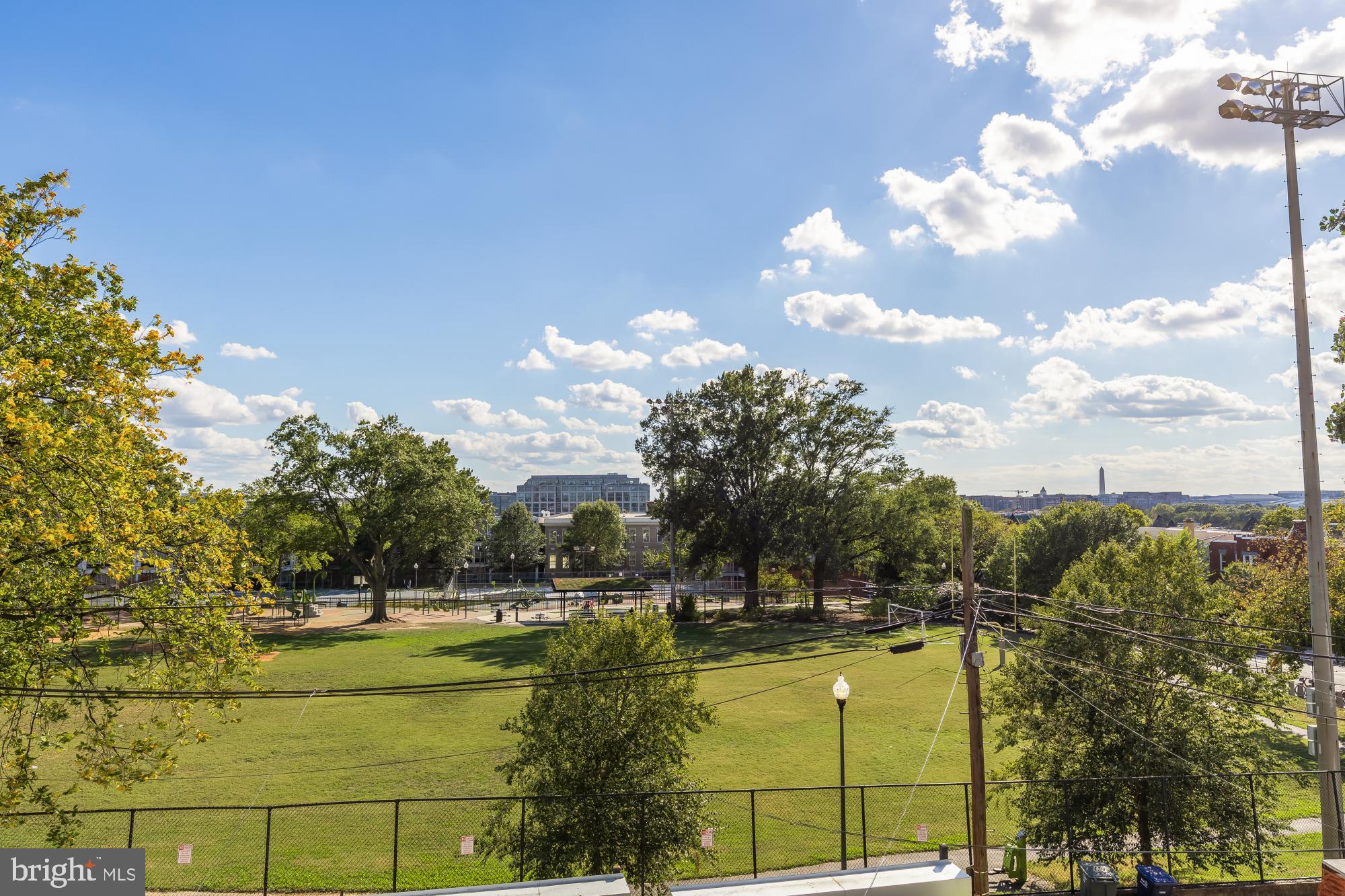 47 T Street Northeast Washington, DC 20002 - Photo 30 of 45 a view of a swimming pool with an outdoor seating and a yard