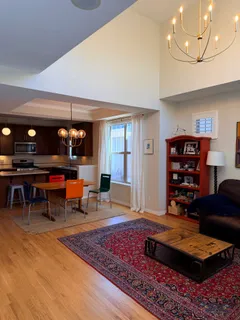 a living room with furniture and a rug