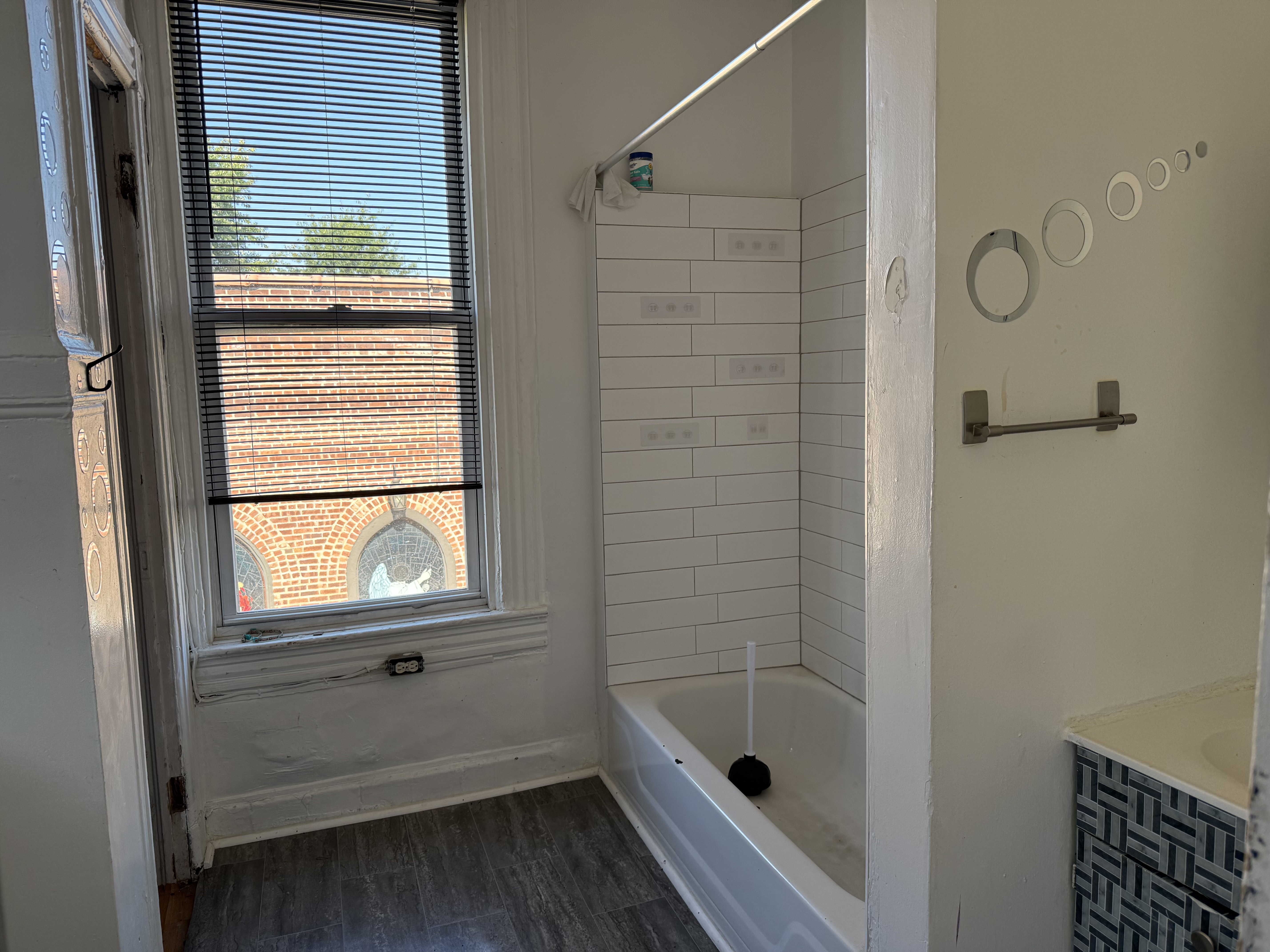 453 Central Avenue Jersey City, NJ 07307 - Photo 12 of 25 a bathroom with a bath tub and a window