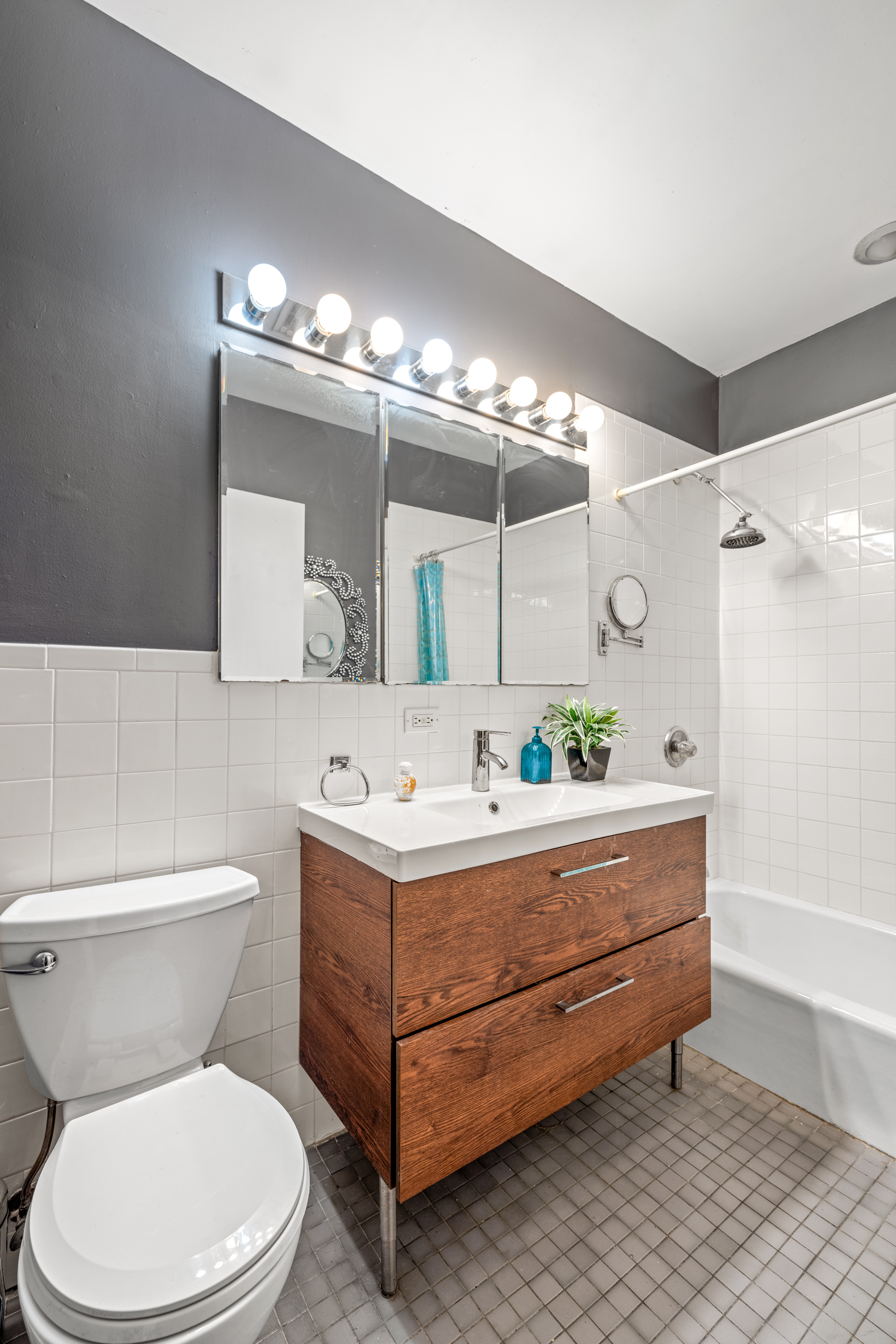 376 Bergen Street, Unit 1R Brooklyn, NY 11217 - Photo 2 of 10 a bathroom with a sink a toilet and a mirror