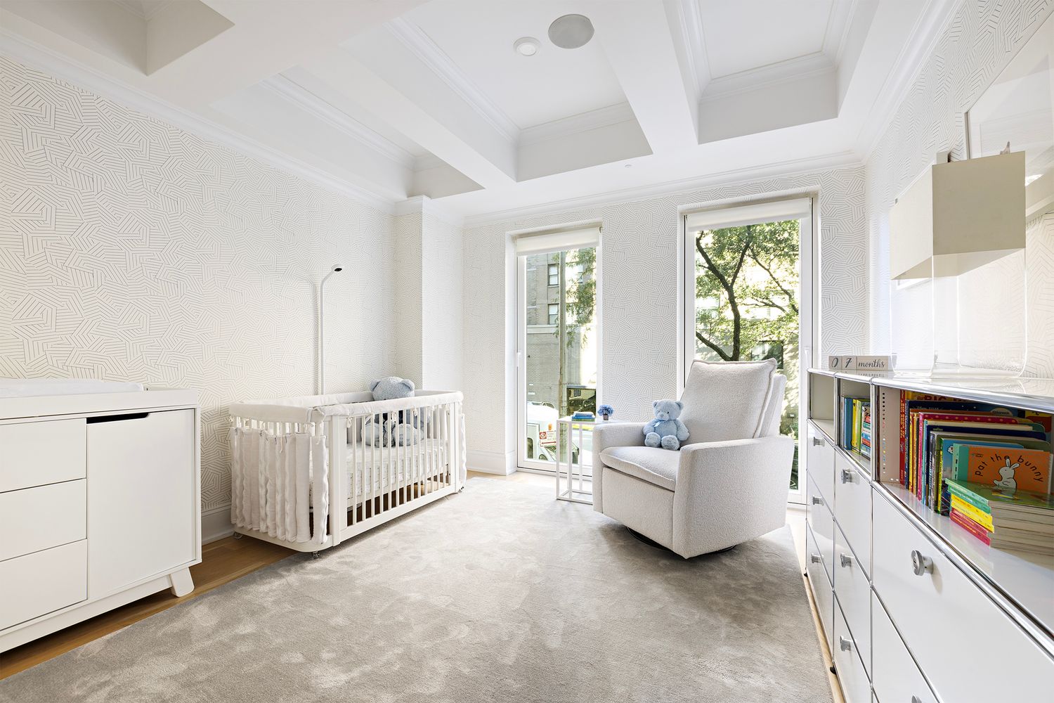 554 East 82nd Street, Unit 1/2 Manhattan, NY 10028 - Photo 7 of 13 a living room with furniture and a flat screen tv