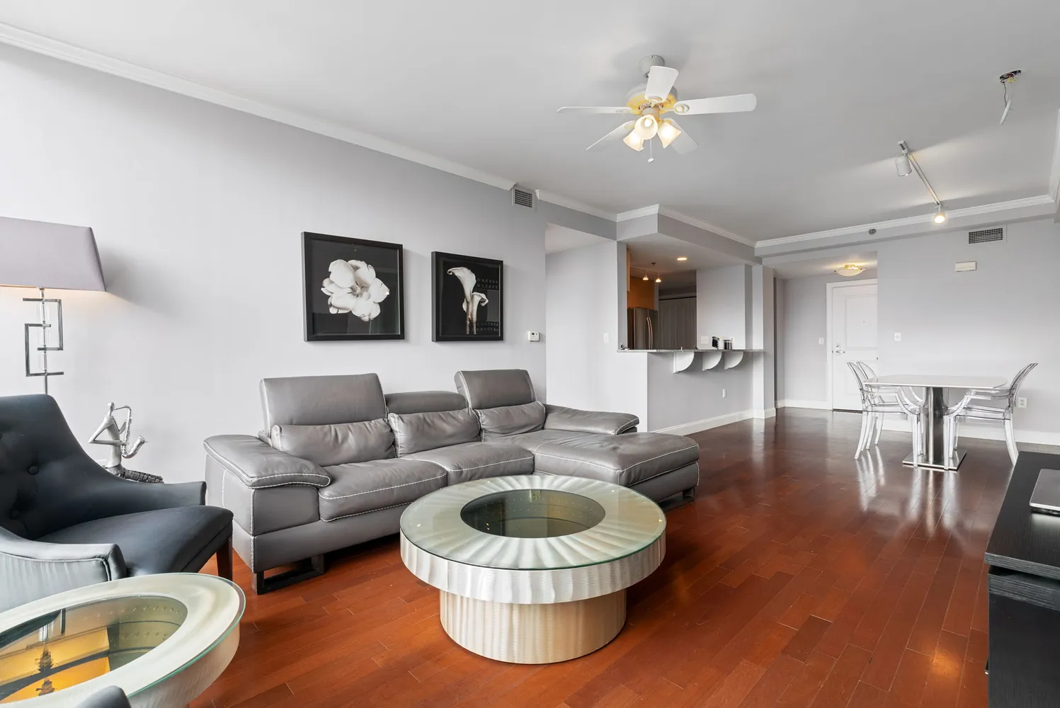 a bedroom with a bed a couch and a large window