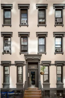 a front view of a multi story residential apartment building