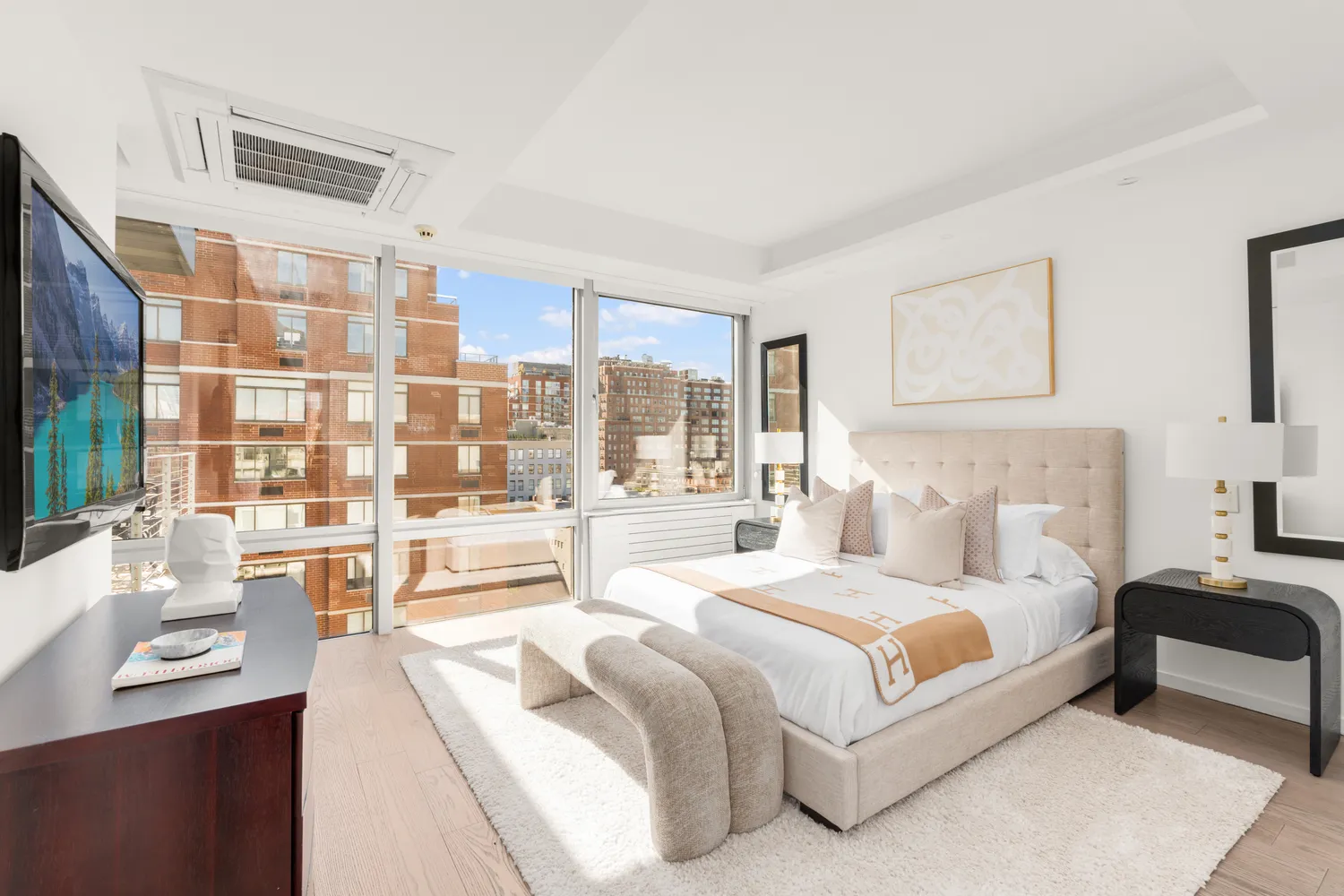 a spacious bedroom with a large bed and a large window