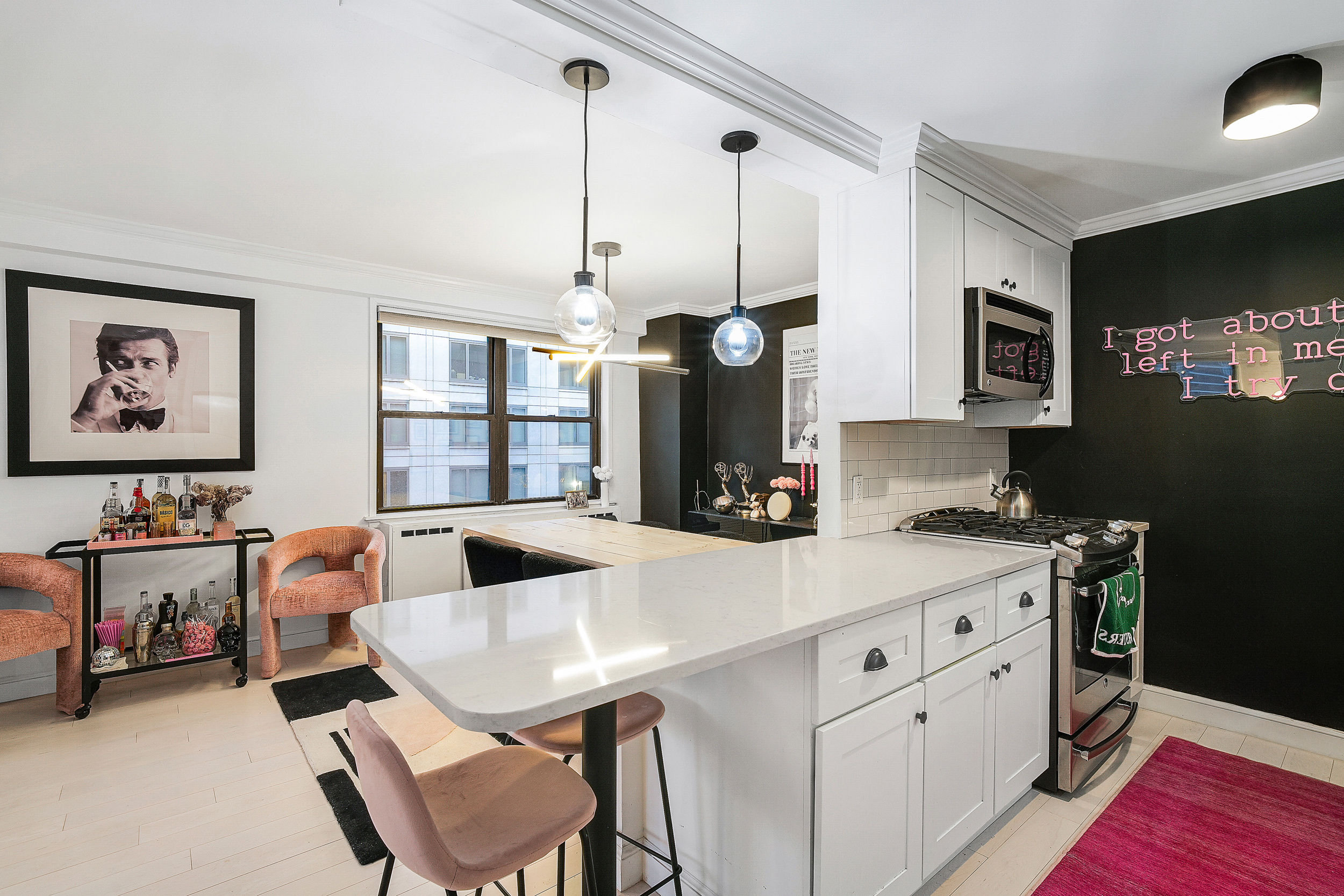 330 3rd Avenue, Unit 15G Manhattan, NY 10010 - Photo 7 of 14 a kitchen that has cabinets a table and chairs in it
