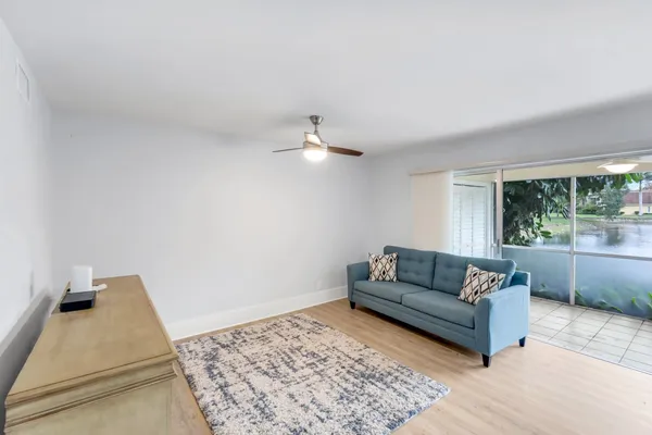 a living room with furniture and a rug