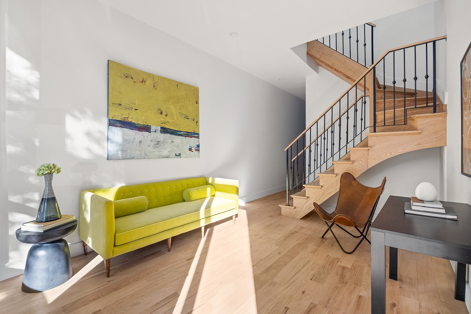 1039 Fulton Street Brooklyn, NY 11238 - Photo 2 of 13 a living room with furniture and a wooden floor