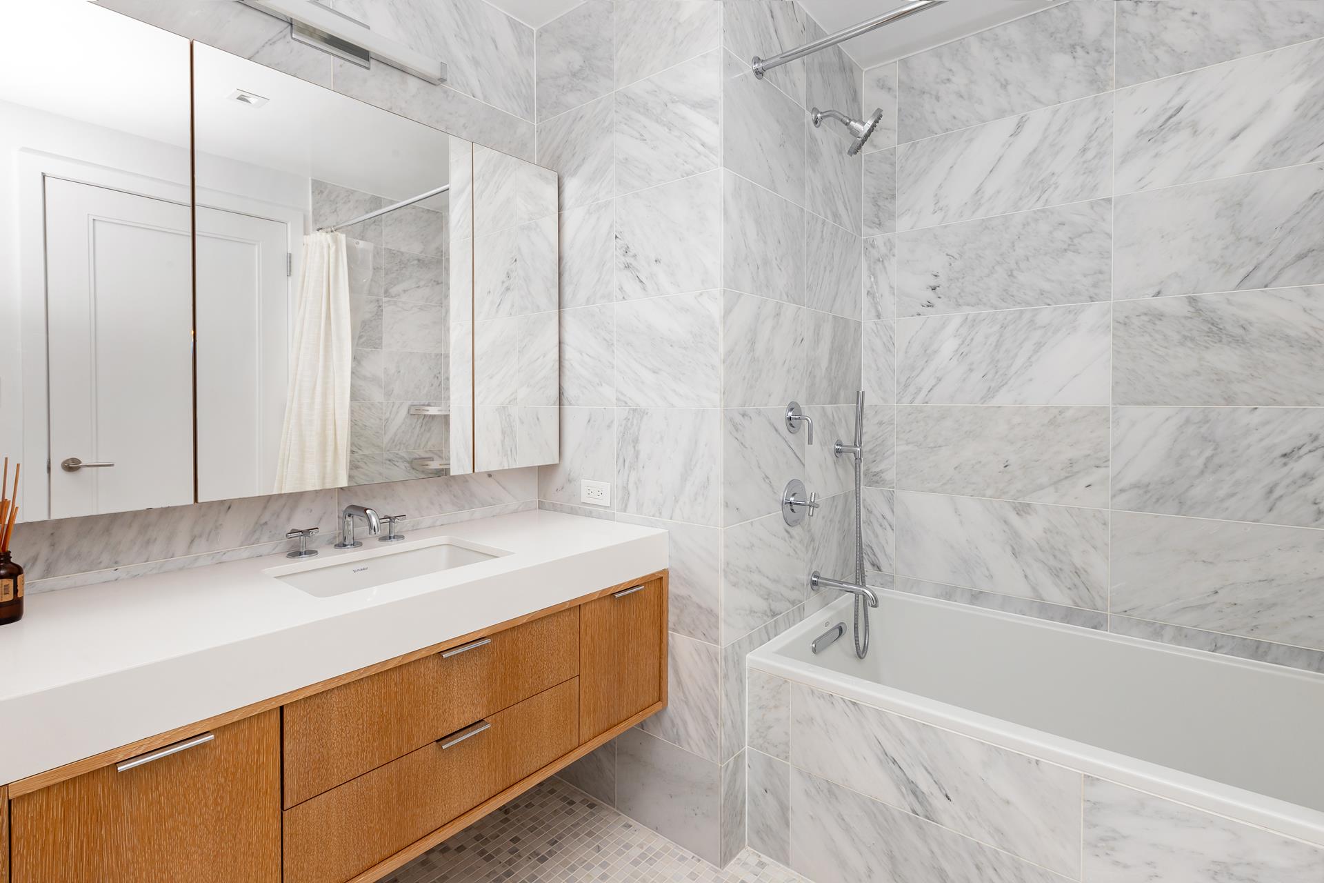 78 Amity Street, Unit 4D Brooklyn, NY 11201 - Photo 8 of 15 a bathroom with a granite countertop sink a mirror bathtub and shower