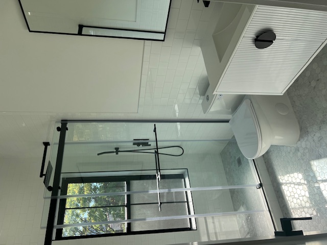 1393 Herkimer Street, Unit 2 Brooklyn, NY 11233 - Photo 4 of 9 a bathroom with a shower a toilet and a sink