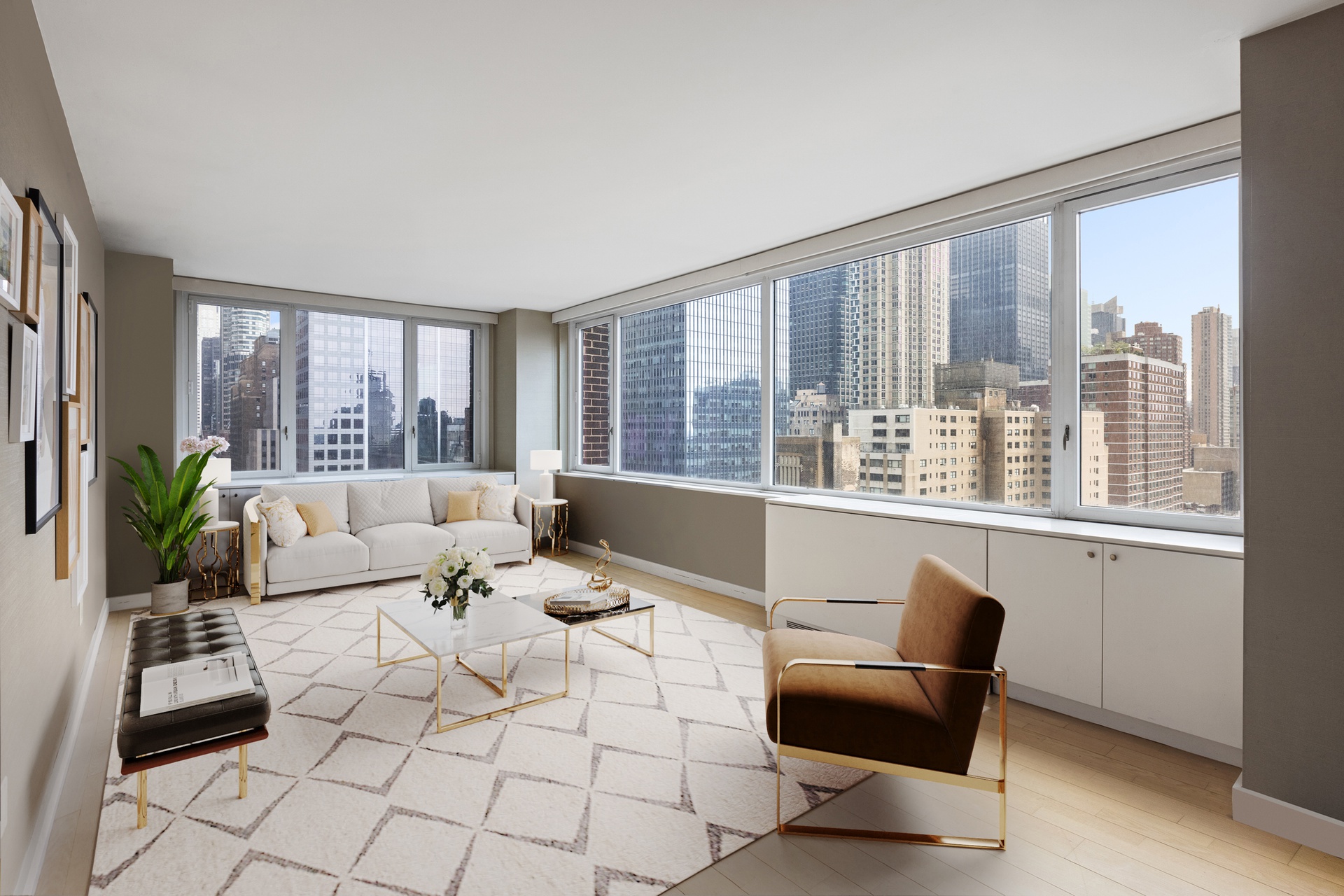 a living room with furniture and large windows