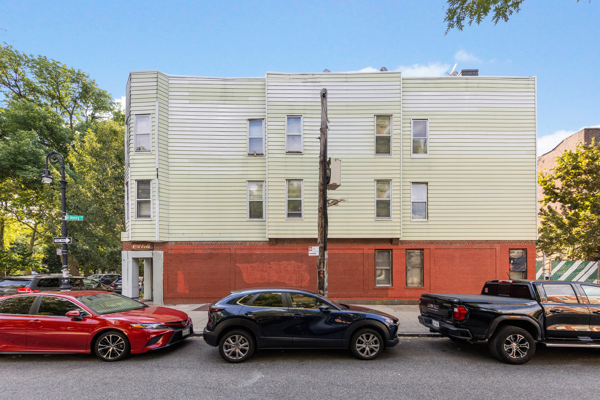 221 Nassau Avenue Brooklyn, NY 11222 - Photo 4 of 11 a car parked in front of a house