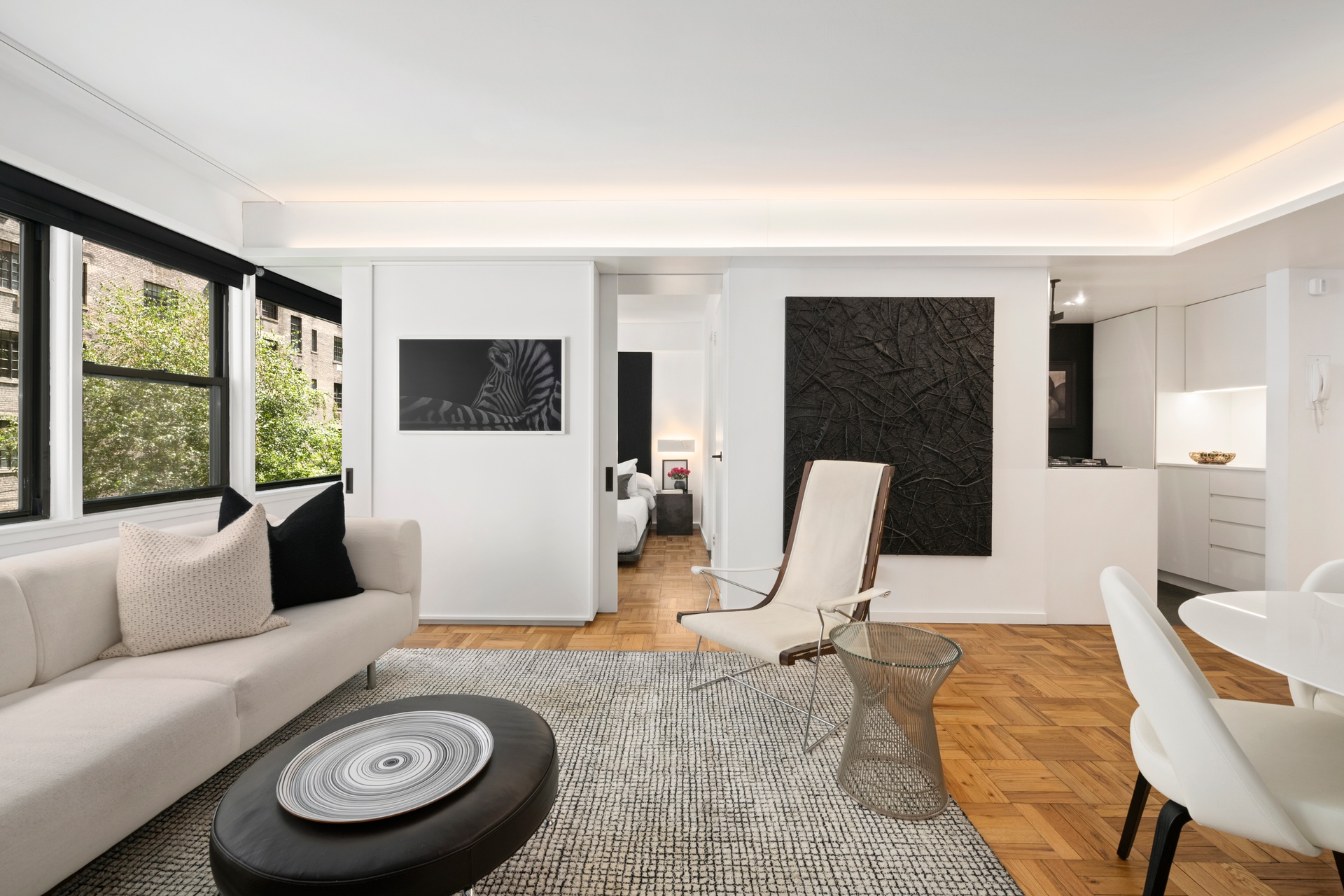 55 East 9th Street, Unit 4N Manhattan, NY 10003 - Photo 3 of 10 a view of a livingroom with furniture and windows