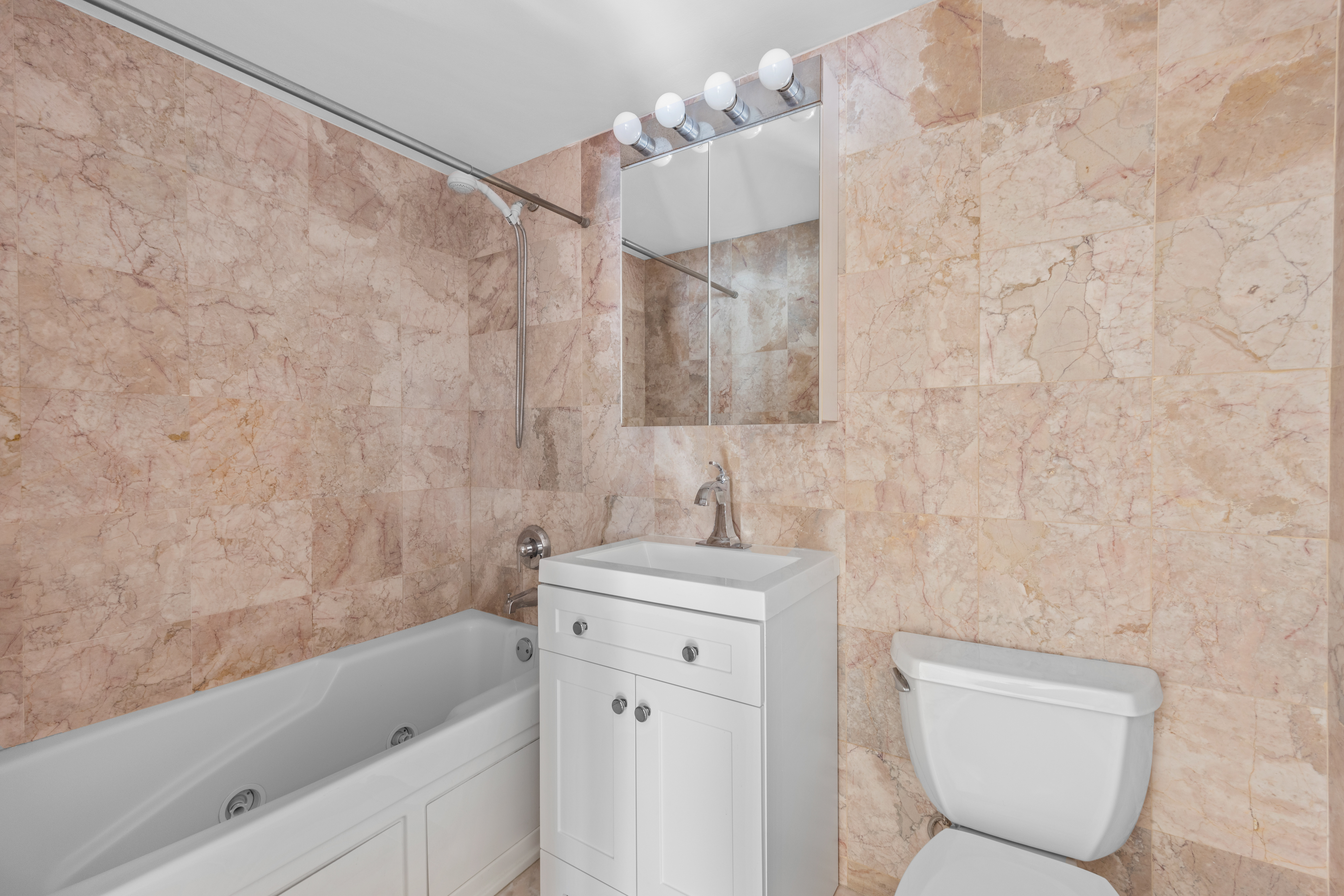 125 Bergen Street, Unit 1A Brooklyn, NY 11201 - Photo 6 of 9 a bathroom with a sink a toilet and shower