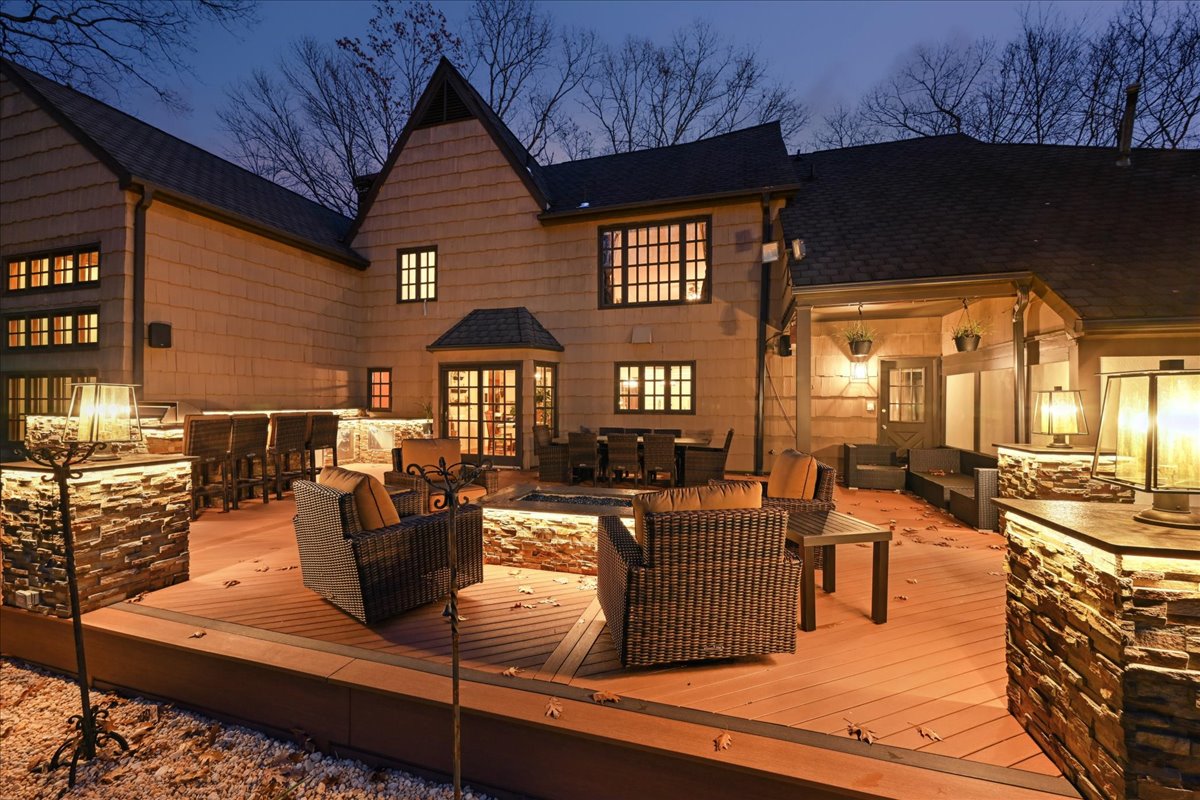 Johnston Drive Watchung, NJ 07069 - Photo 5 of 85 a living room with furniture a fireplace and a flat screen tv