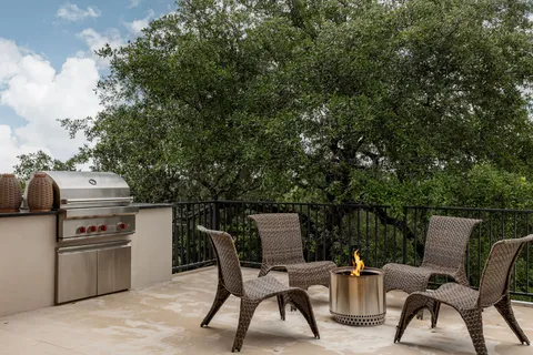 a view of a chairs and table in the terrace