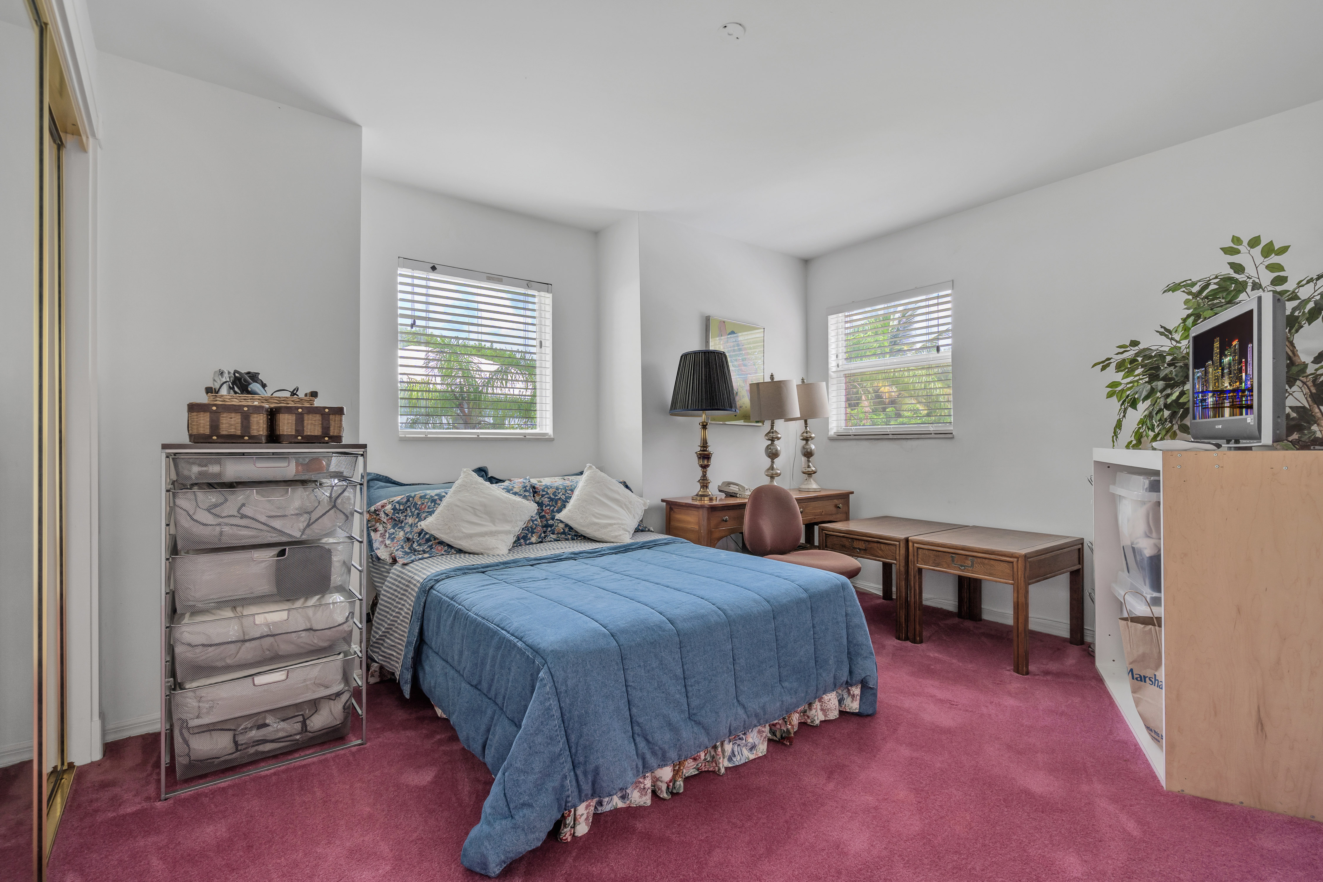 8768 Southwest 62nd Court Miami, FL 33156 - Photo 40 of 56 a bedroom with a bed and a couch