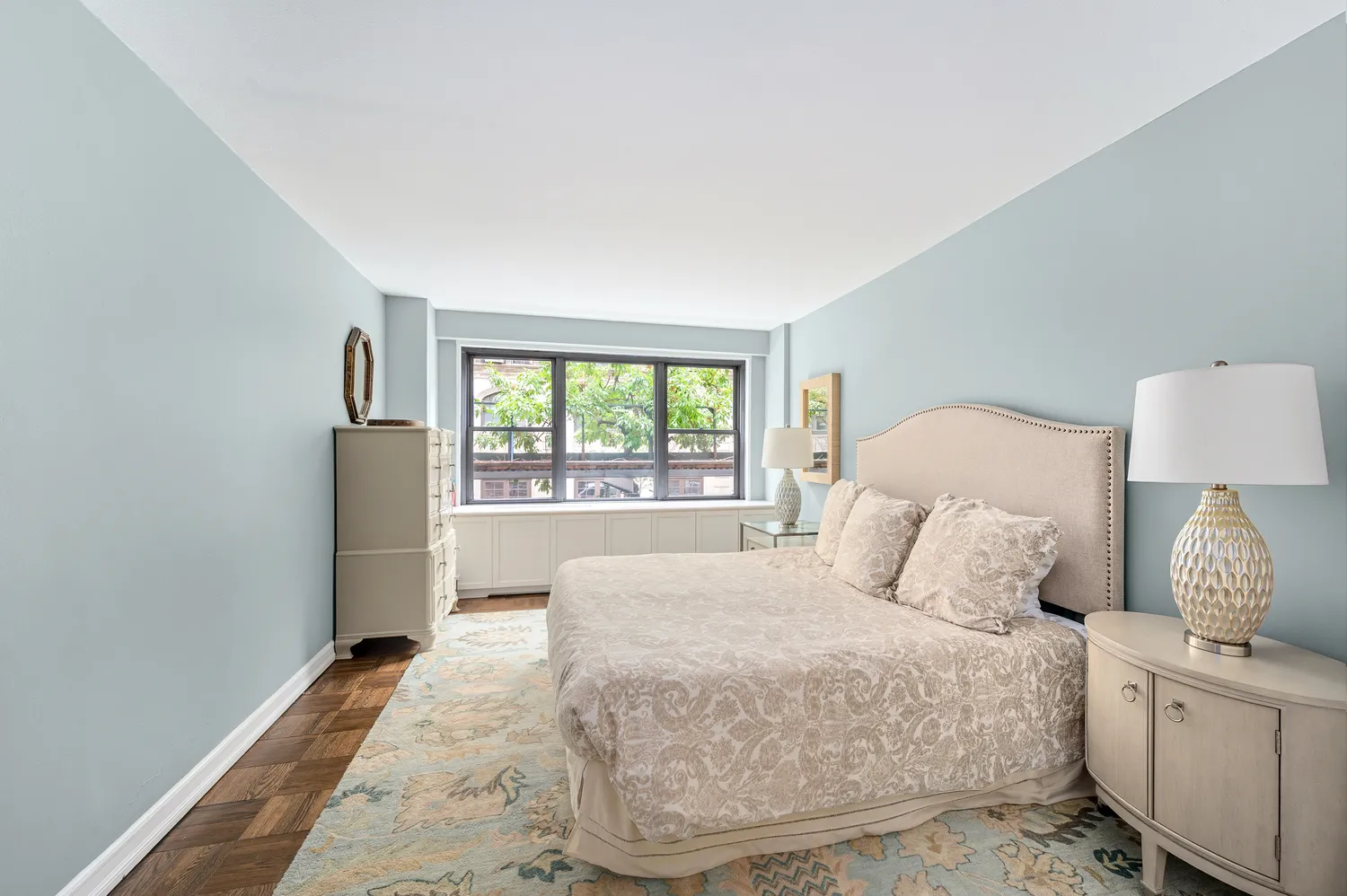 a bedroom with a large bed and a window