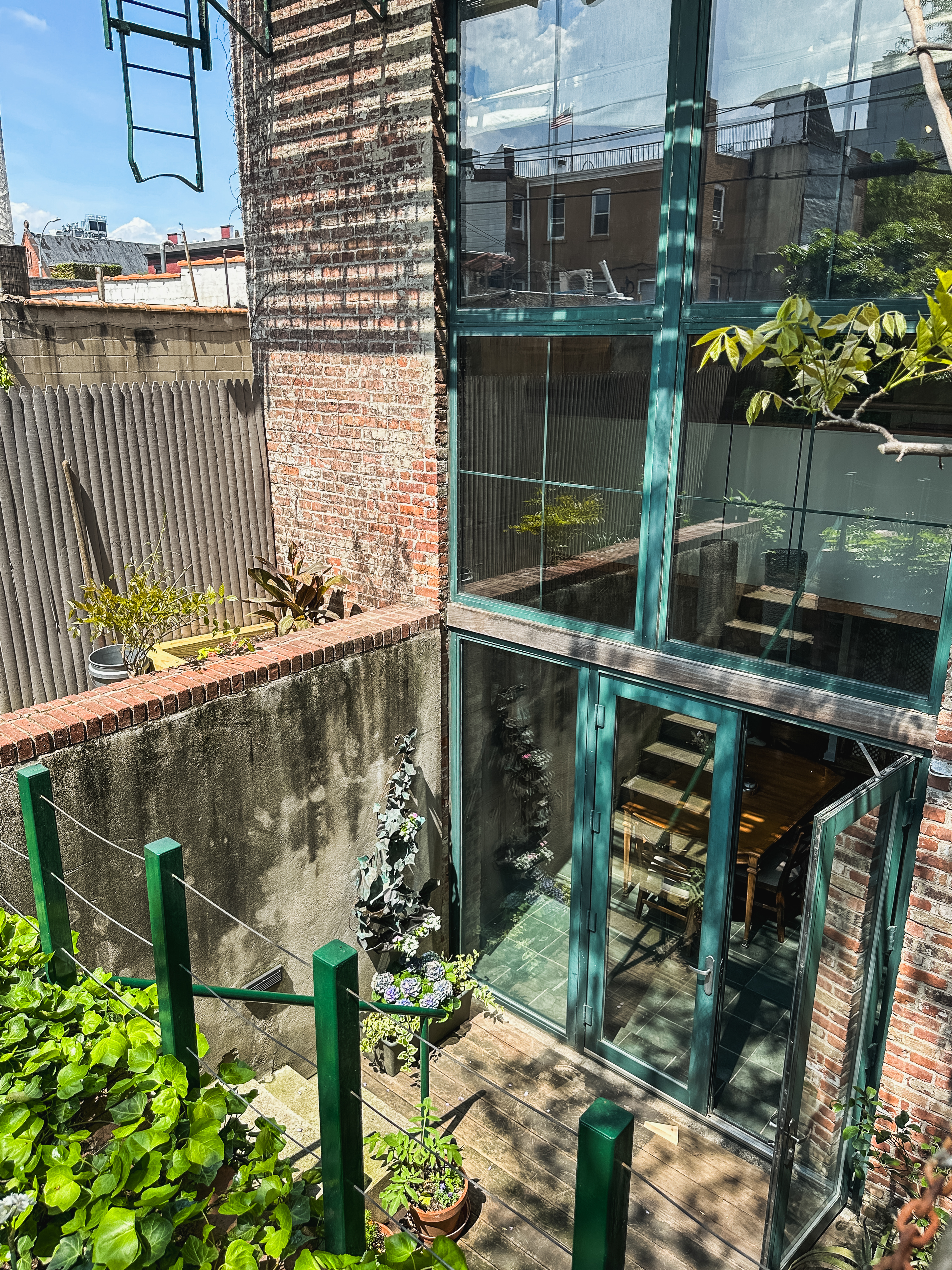 248 17th Street, Unit 6 Brooklyn, NY 11215 - Photo 5 of 21 a glass door with outdoor seating