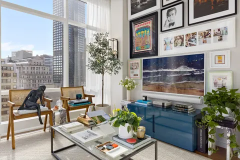 a view of a patio with table and chairs and potted plants