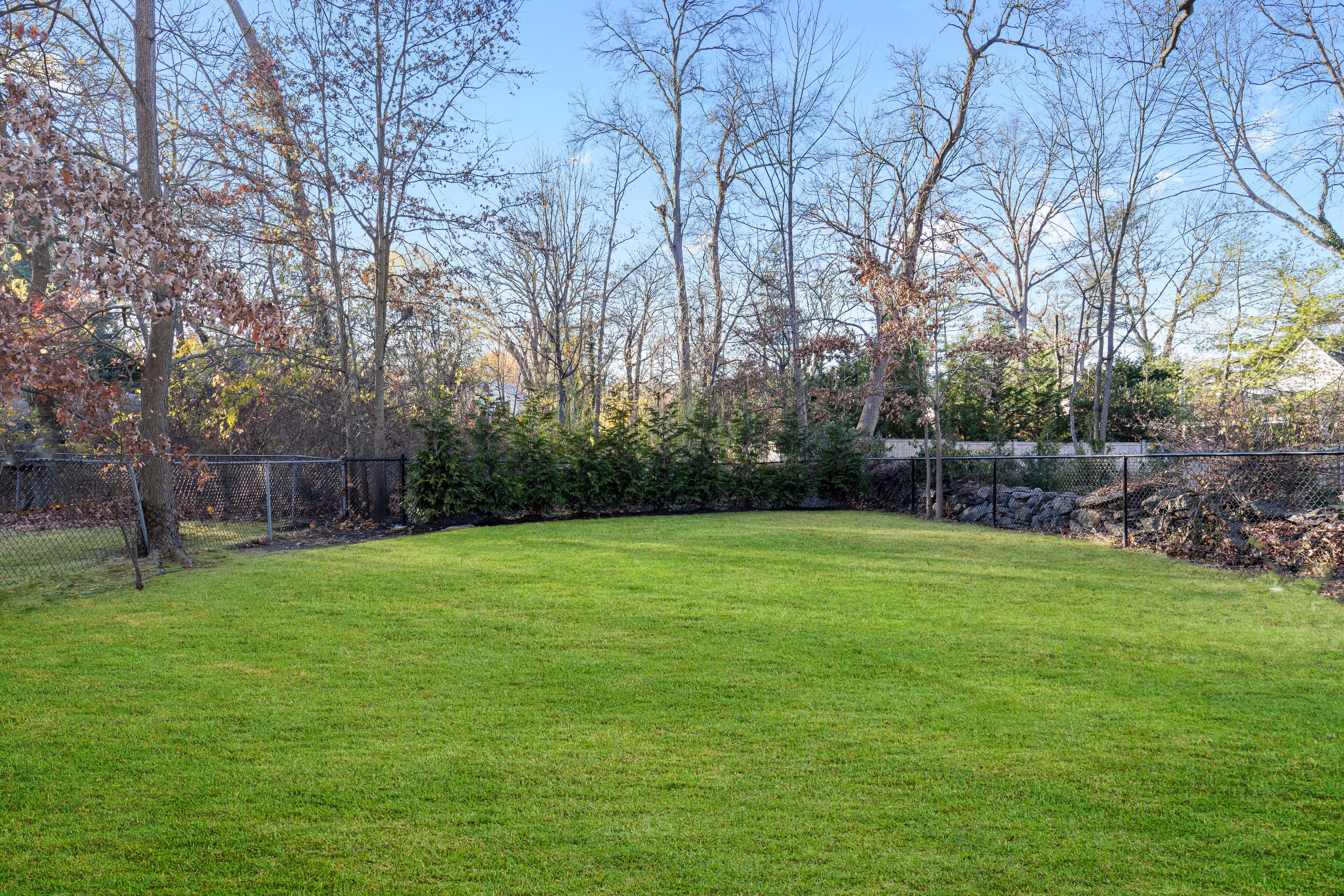 467 Midland Avenue Rye, NY 10580 - Photo 19 of 19 a backyard of a house with lots of green space