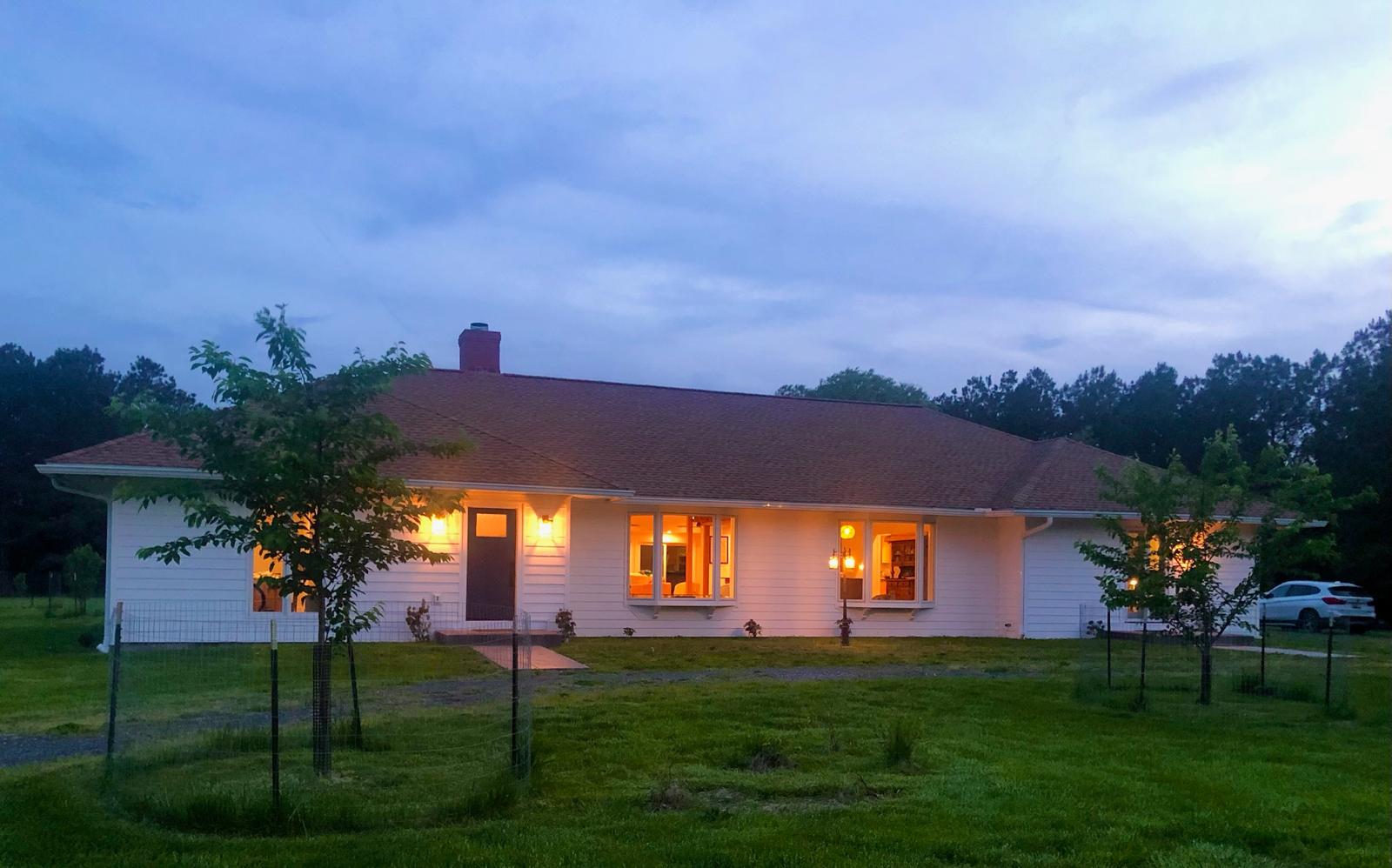 a view of house with a big yard