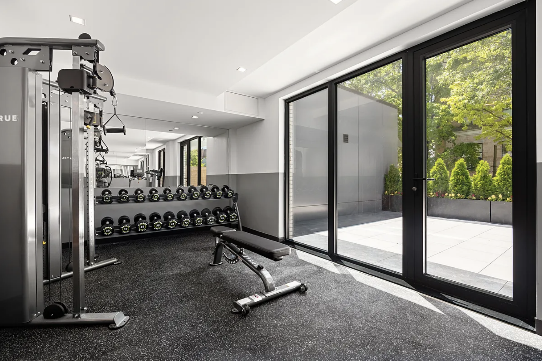 27-09 40th Avenue, Unit 3I Queens, NY 11101 - Photo 7 of 13 a view of a room with gym equipment