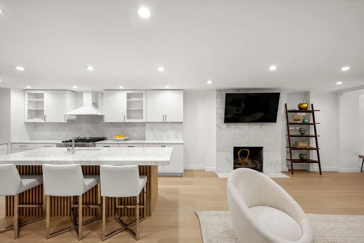 222 East 61st Street Manhattan, NY 10065 - Photo 23 of 28 a living room with furniture a fireplace and a flat screen tv