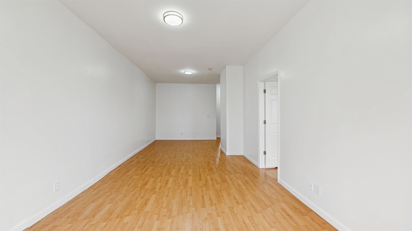 454 77th Street, Unit 3 Brooklyn, NY 11209 - Photo 10 of 25 a view of empty room with wooden floor