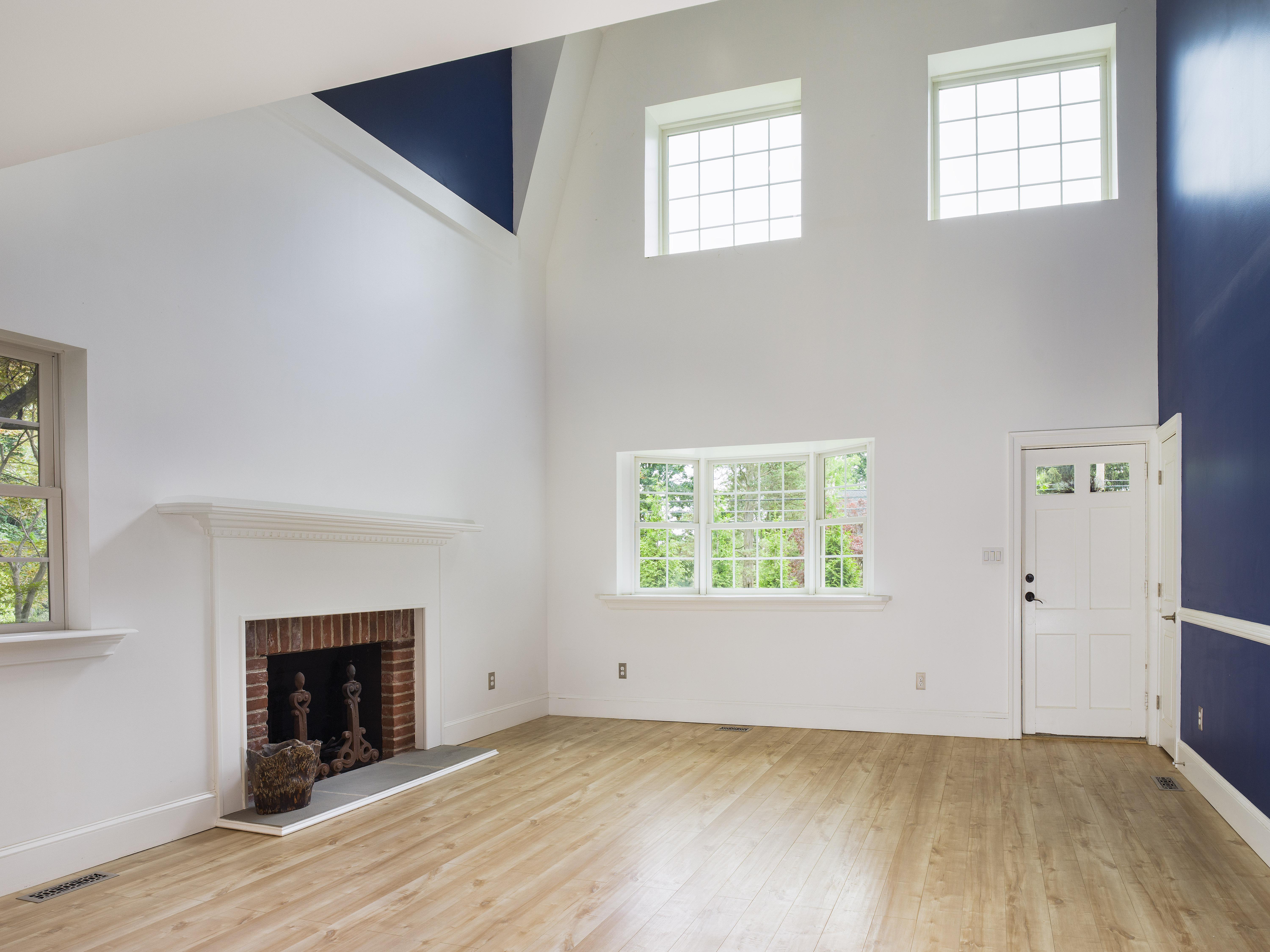 319 West Conestoga Road Devon, PA 19333 - Photo 11 of 38 an empty room with windows and fireplace
