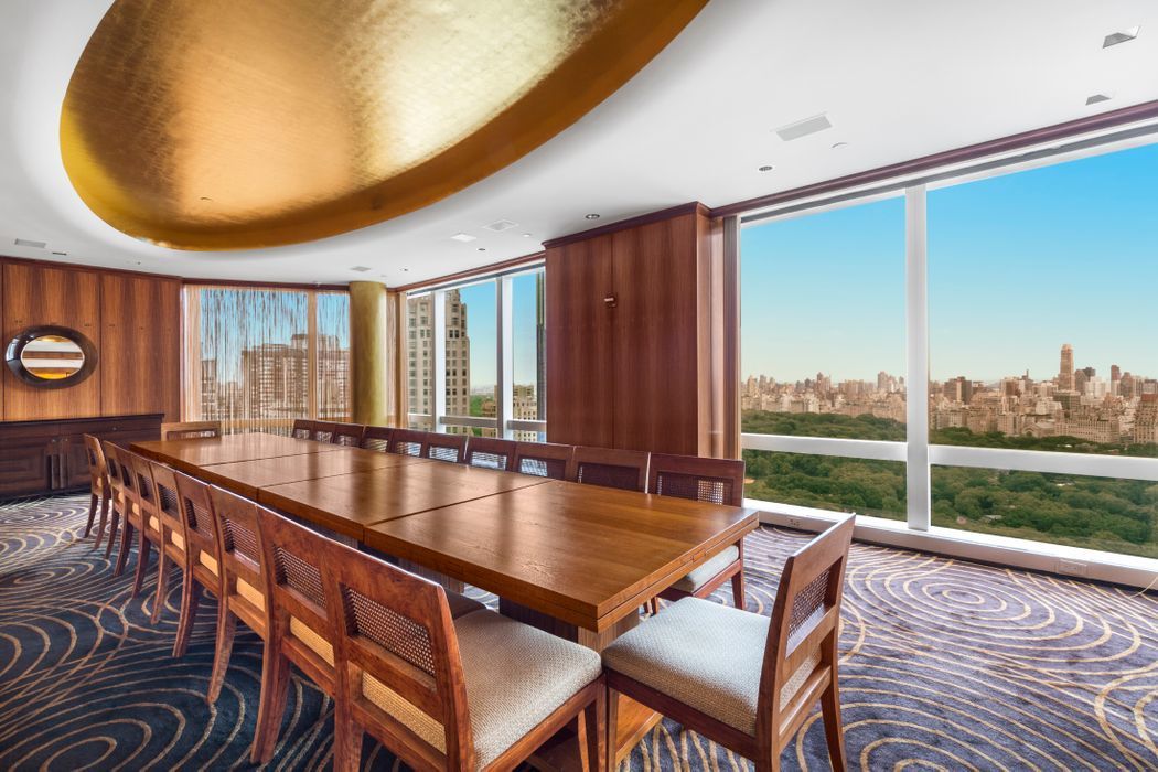25 Columbus Circle, Unit 75A Manhattan, NY 10019 - Photo 25 of 36 a dining room with furniture and a floor to ceiling window