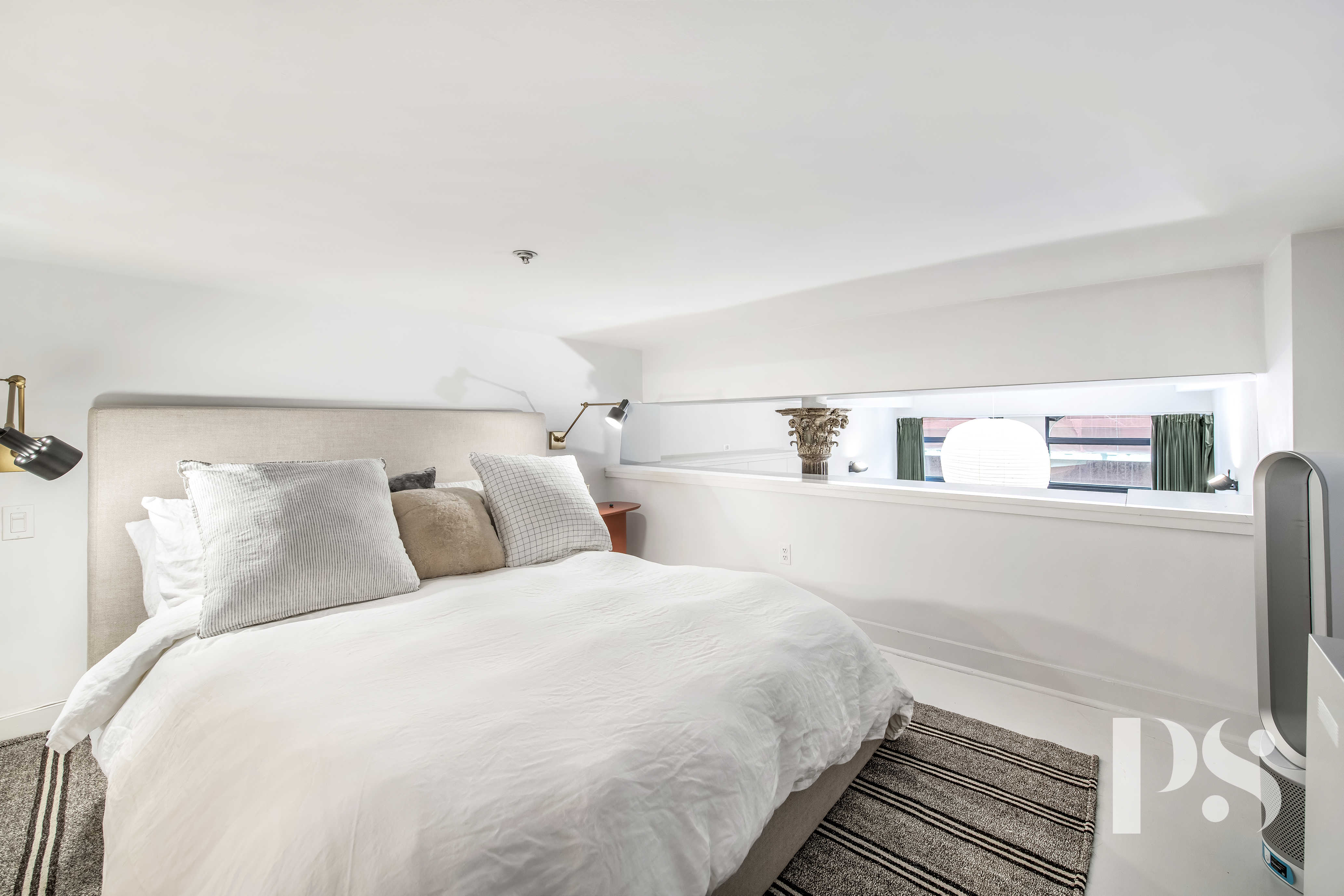 67 East 11th Street, Unit 517 Manhattan, NY 10003 - Photo 9 of 13 a bedroom with a bed and a night stand